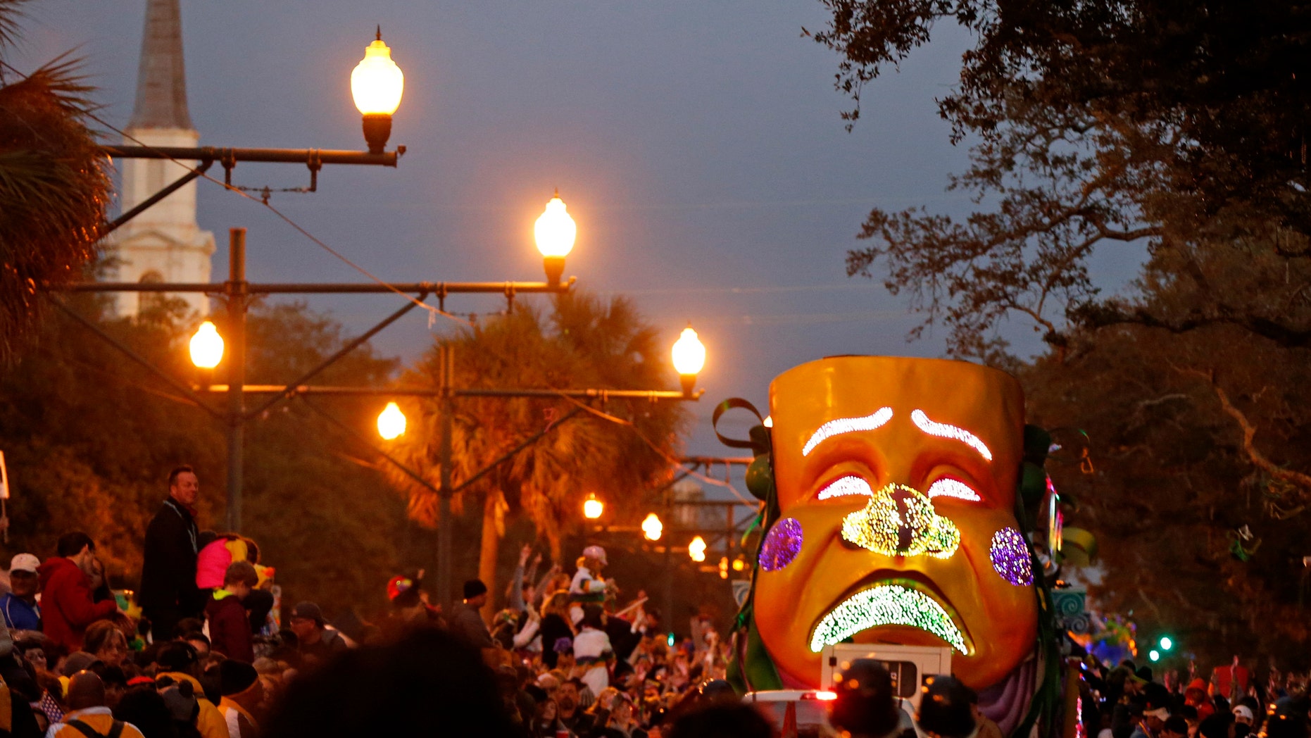 Floats ride down Canal street as the Mardi Gras parade rolls through New Orleans.