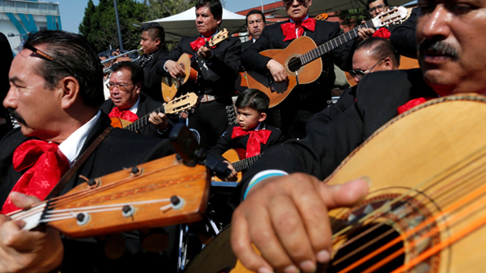 Mexico's police are hoping forming a mariachi band -- like one seen above playing in Mexico City on November 22, 2016 -- will help improve their reputation with countrymen.