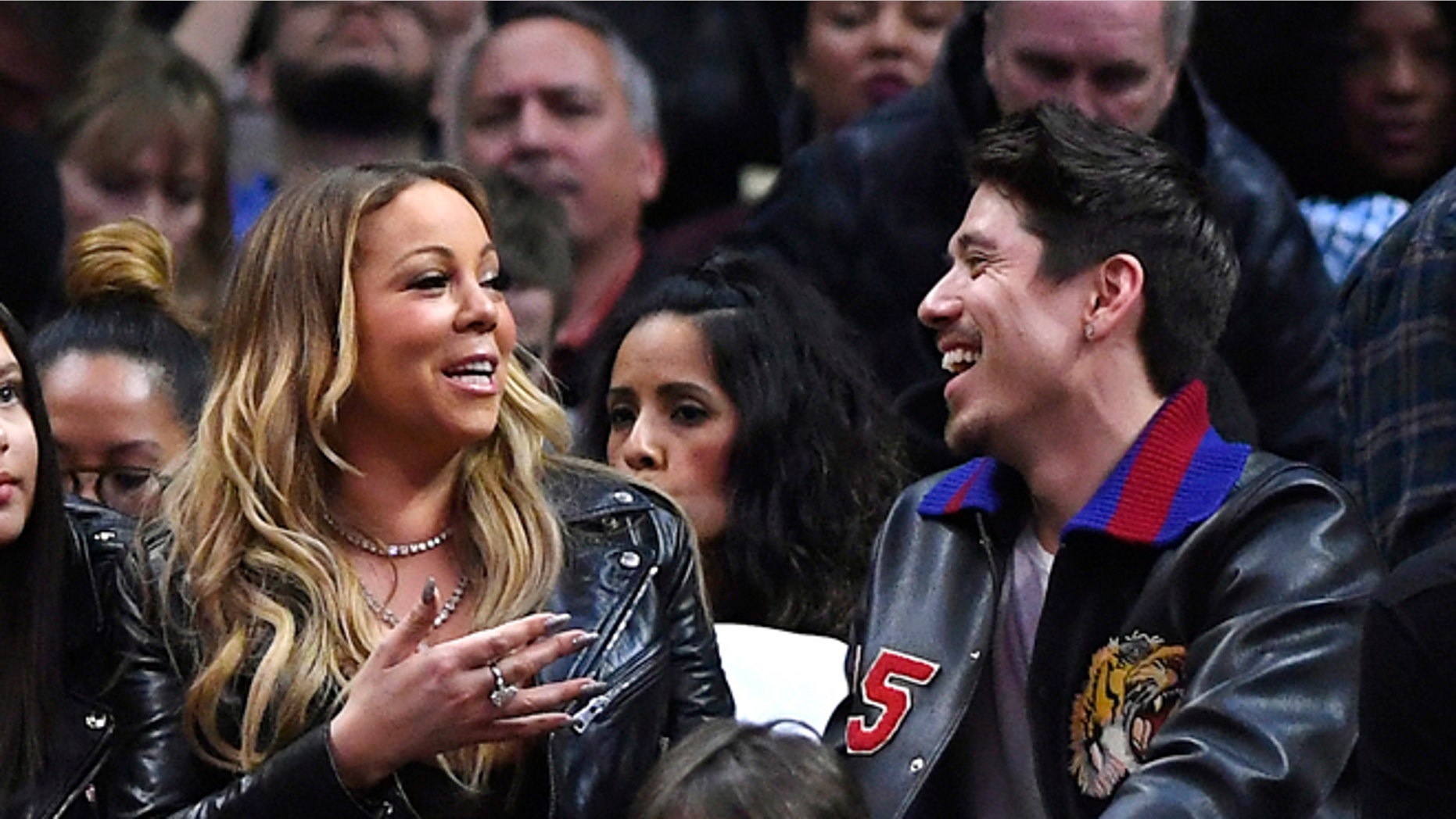 Mariah Carey confirmed she's dating backup dancer Bryan Tanaka.