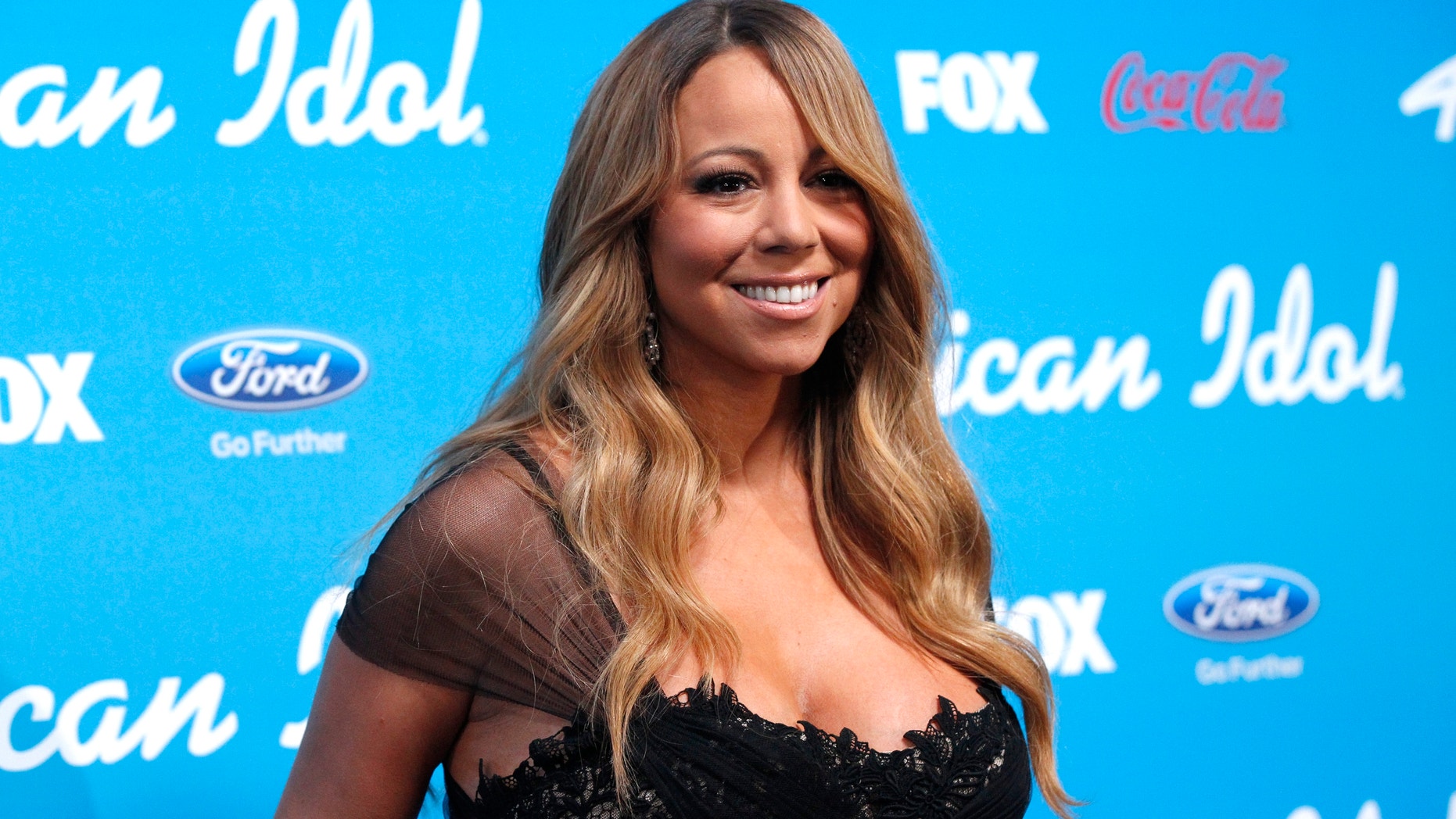Mariah Carey poses at the party for the finalists of the television show "American Idol" in Los Angeles, California March 7, 2013.