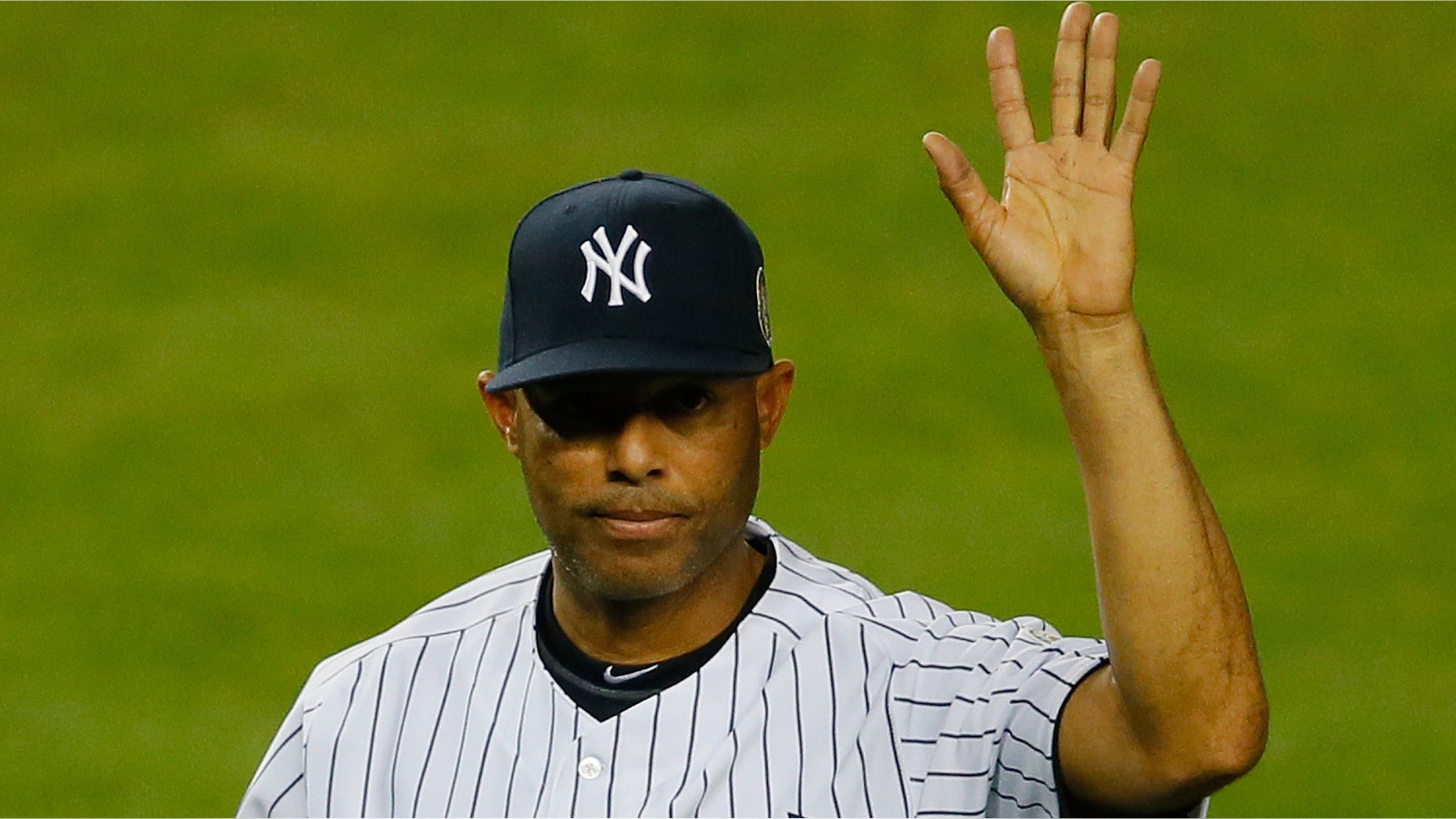 NEW YORK, NY - SEPTEMBER 26: Mariano Rivera #42 of the New York Yankees walks back to the dugout after collecting some dirt from the pitcher's mound after the game against the Tampa Bay Rays at Yankee Stadium on September 26, 2013 in the Bronx borough of New York City. (Photo by Mike Stobe/Getty Images)