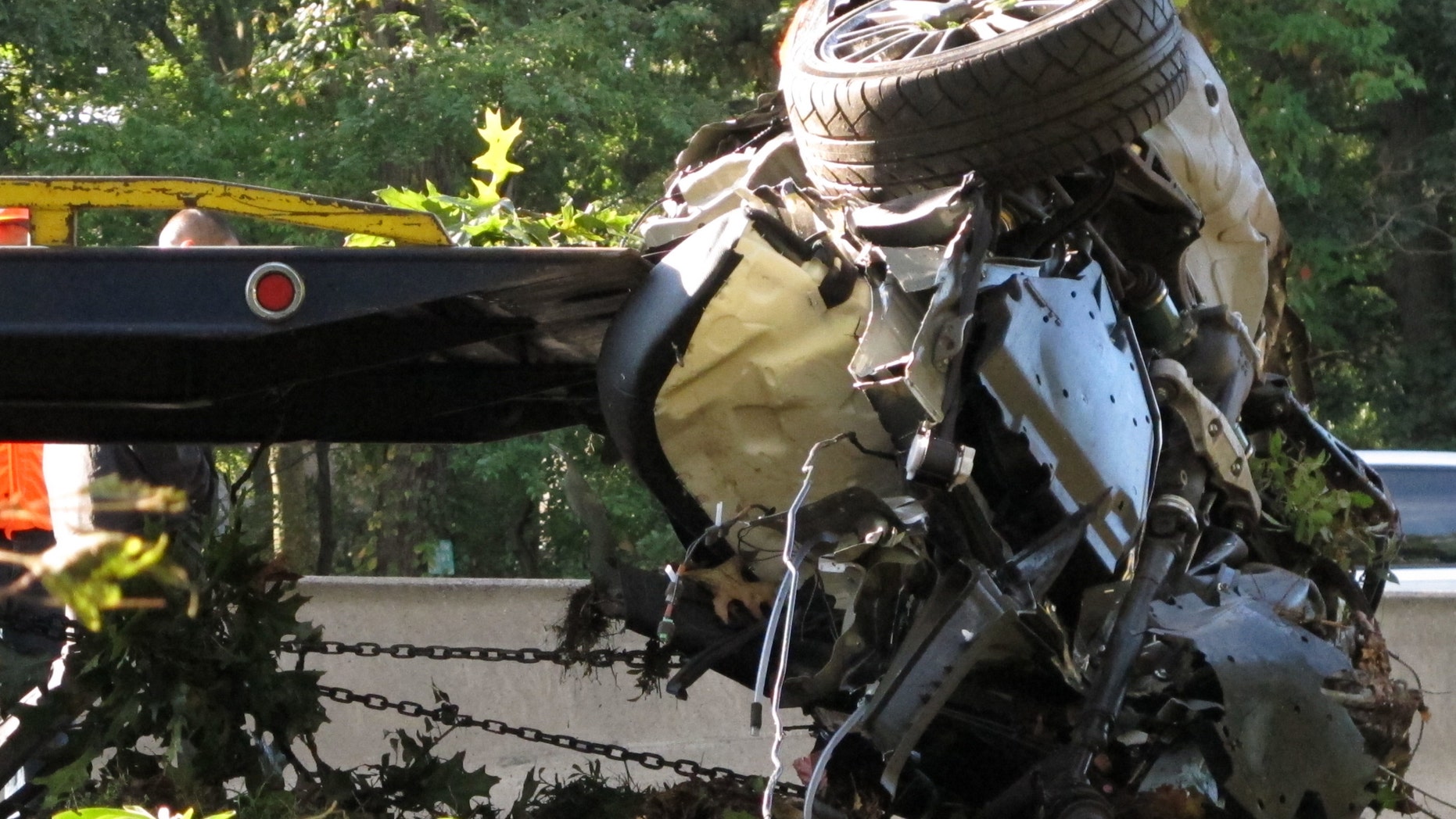 This Oct. 8, 2012 file photo shows the wrecked Subaru Impreza in which four people died as it is loaded onto a flatbed truck on the Southern State Parkway in West Hempstead, N.Y., after and early-morning accident. At the wheel was a New York teenager, Joseph Beer, who had smoked about $20 worth of marijuana, before getting into the car with four friends, and driving over 100 mph before crashing into trees with such force that it split the car in half. (AP Photo/Frank Eltman, File)