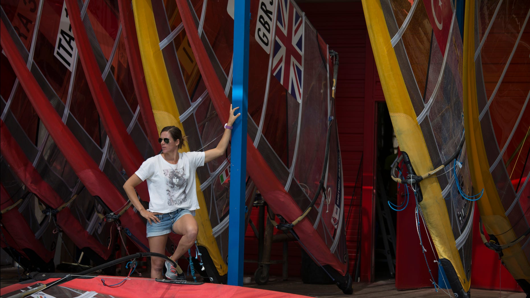 Marina Alabau, a Spanish windsurfer and a gold medalist at London Olympics, stands by her surf borads in Eliat, Israel, Friday, Feb. 19, 2016 as she prepares for the RS:X World Championship. Alabau said she got Zika while training in Brazil in December, making her possibly the first Olympic athlete to come down with a virus that the World Health Organization has deemed an "international health emergency." (AP Photo/Tsafrir Abayov)