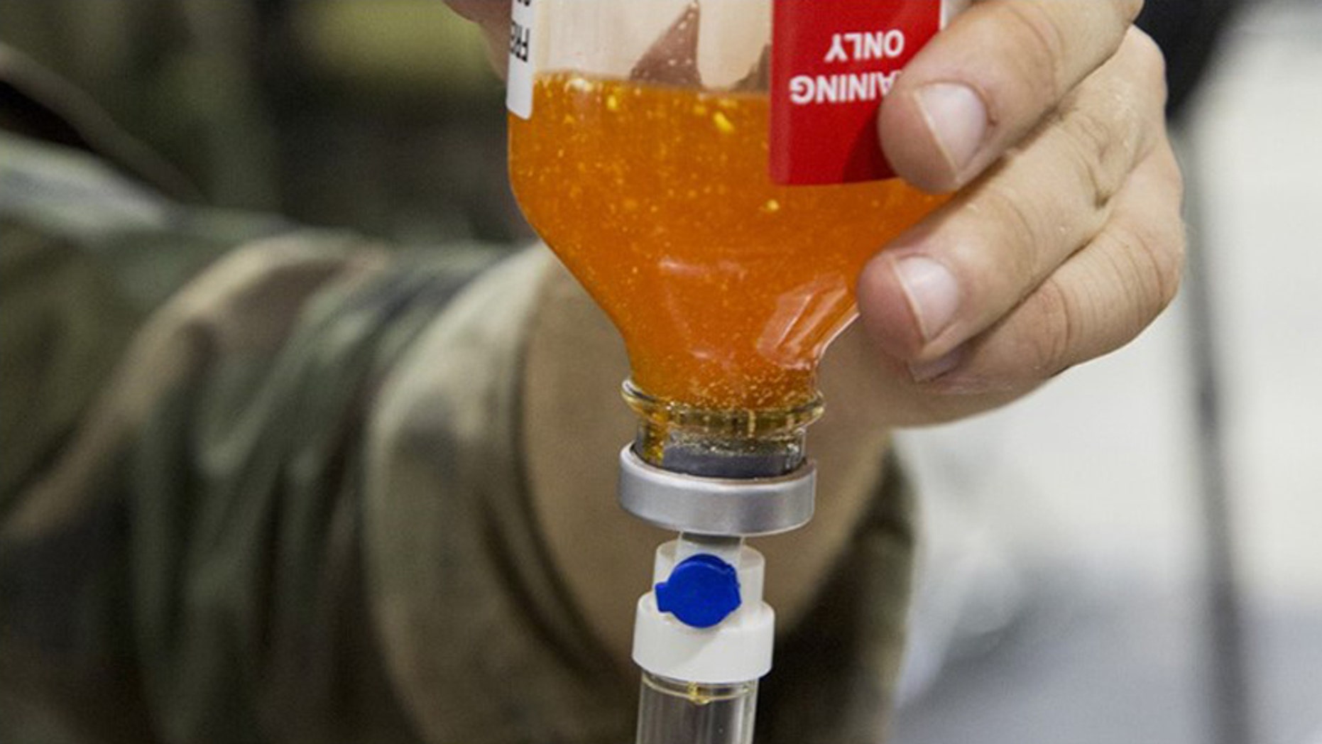 CAMP SHELBY JOINT TRAINING CENTER, Miss. - Critical Skills Operators with U.S. Marine Corps Forces, Special Operations Command simulate administering freeze-dried plasma to a role-playing casualty during a Raven exercise at Camp Shelby Joint Force Training Center, Miss., May 1, 2017. (Photo By: Sgt. Salvador R. Moreno)