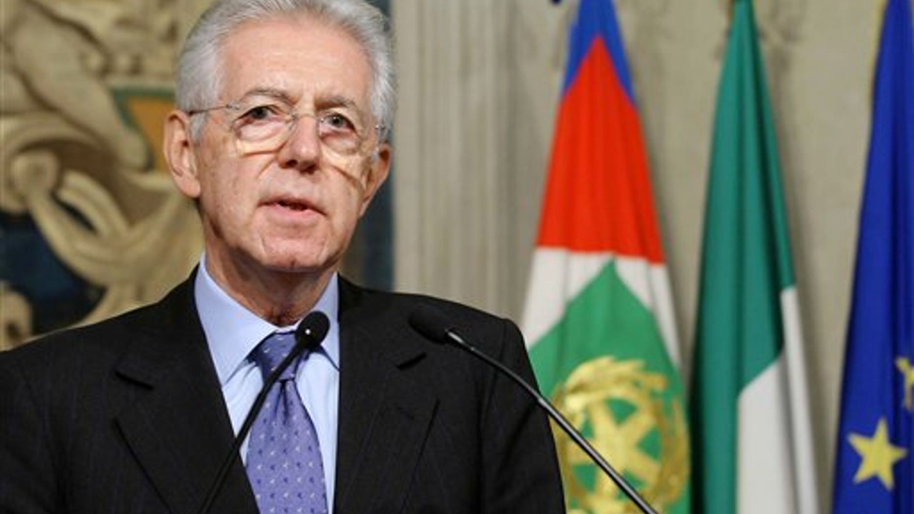Nov. 13, 2011: Italy's new premier-designate economist Mario Monti meets with journalists at the Quirinale Presidential Palace after talks with Italian President Giorgio Napolitano in Rome. Monti told reporters Sunday night he will carry out the task "with a great sense of responsibility and service toward this nation."