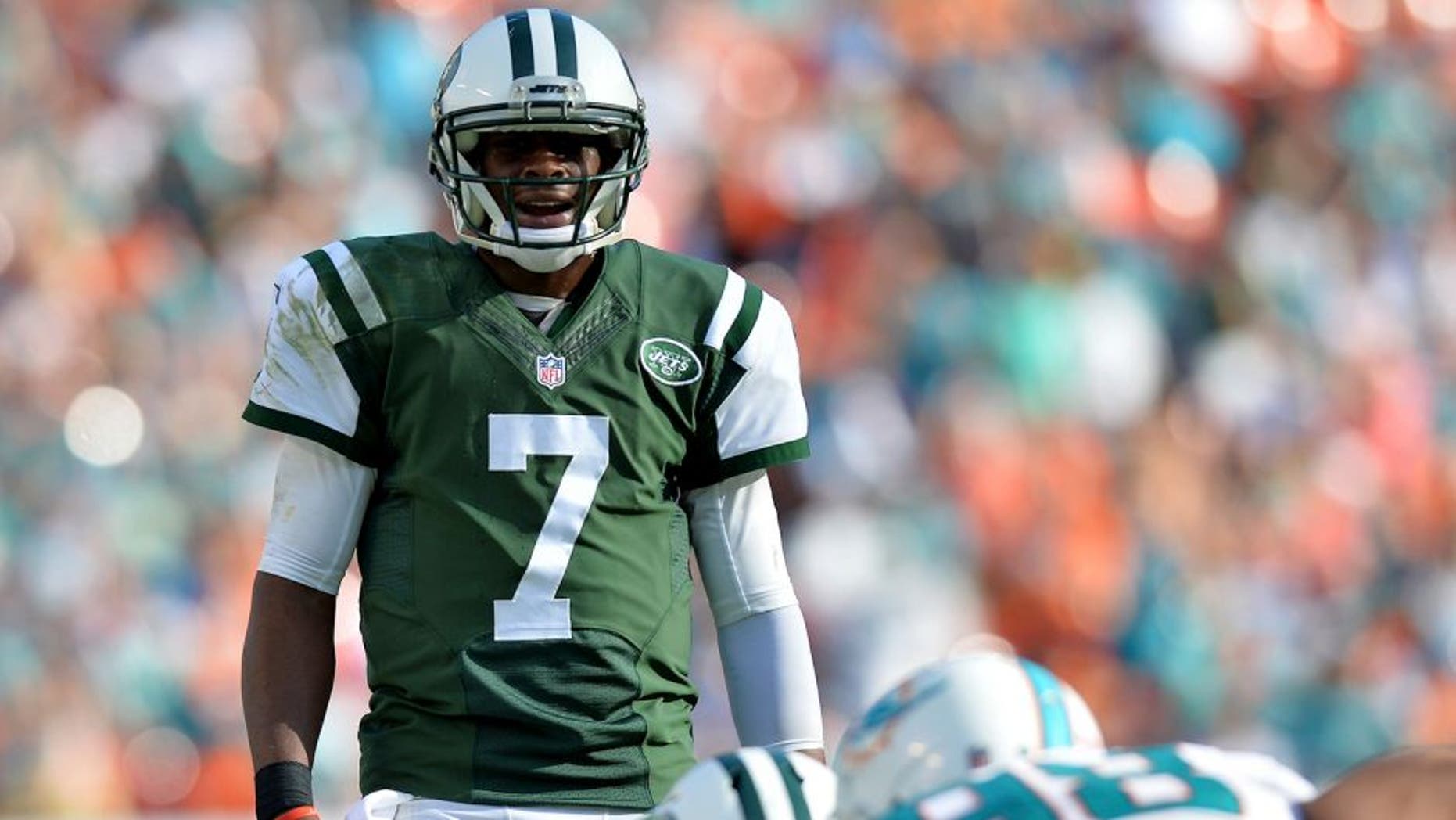 Dec 28, 2014; Miami Gardens, FL, USA; New York Jets quarterback Geno Smith (7) yells out from the line of scrimmage against the Miami Dolphins during the second half at Sun Life Stadium. Mandatory Credit: Steve Mitchell-USA TODAY Sports