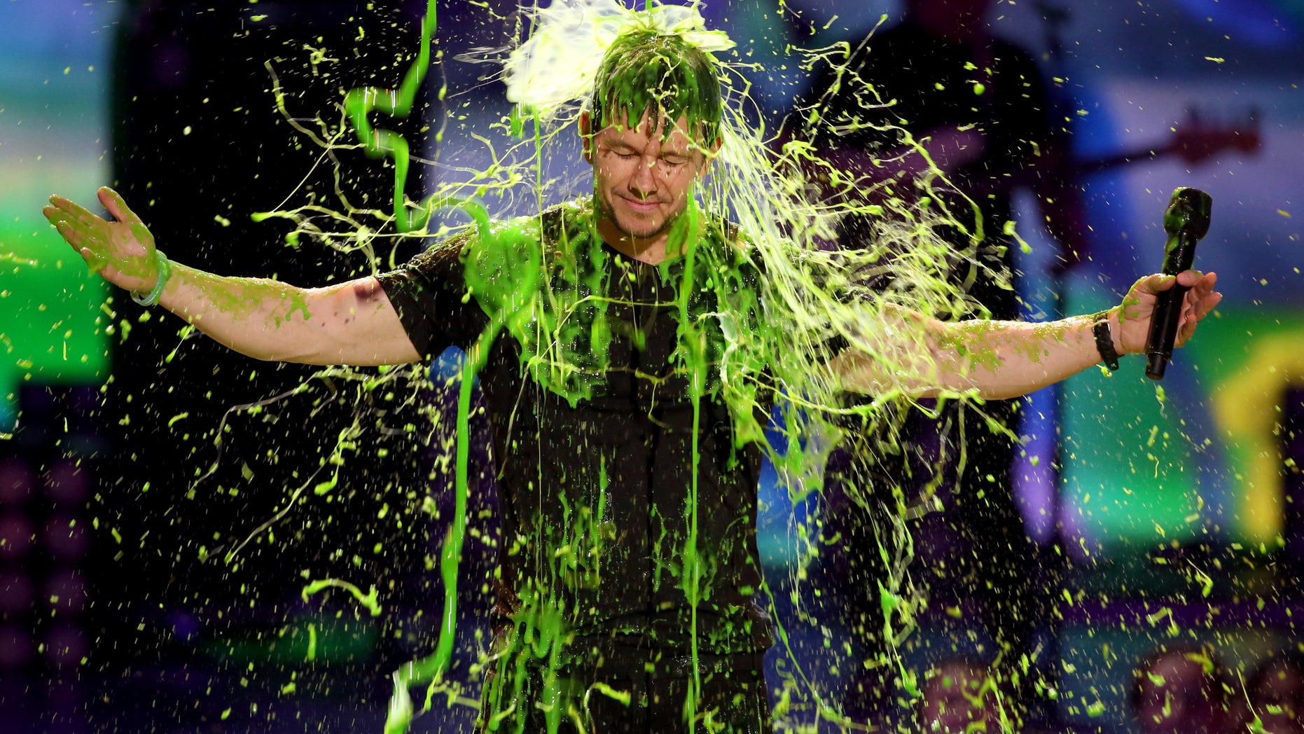 March 29, 2014. Mark Wahlberg gets slimed at the 27th annual Kids' Choice Awards at the Galen Center in Los Angeles.