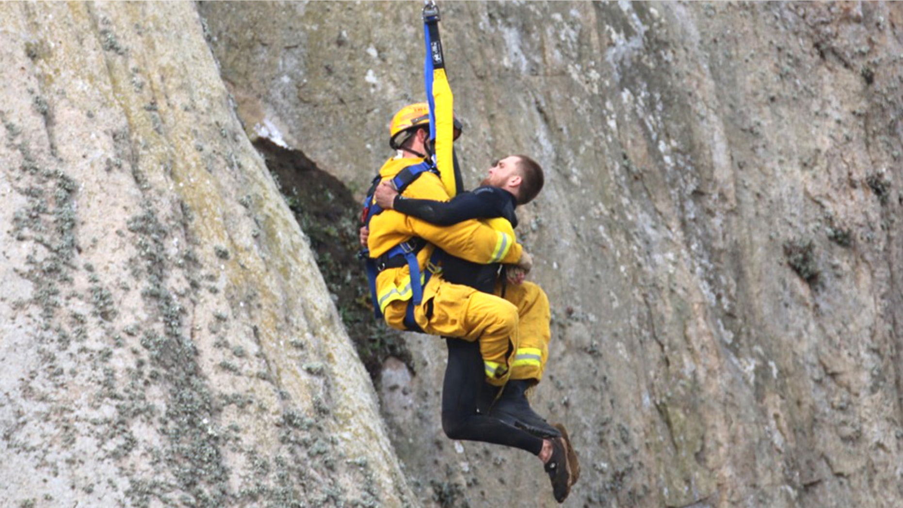 April 7, 2016: Michael Banks is rescued after being stranded on a ledge some 80 off the ground on Morro Rock in Morro Bay, Calif.