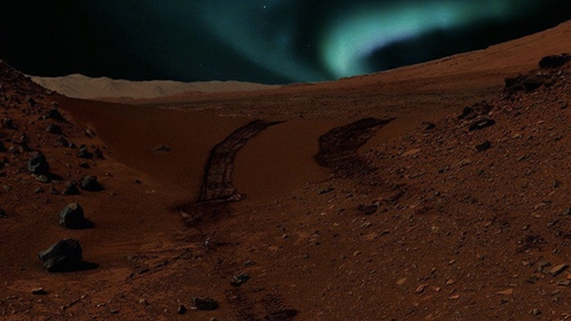 This artist's conception shows auroras visible on Mars caused by magnetic anomalies. Even brighter Martian auroras may light the sky in regions with no magnetic field at all.