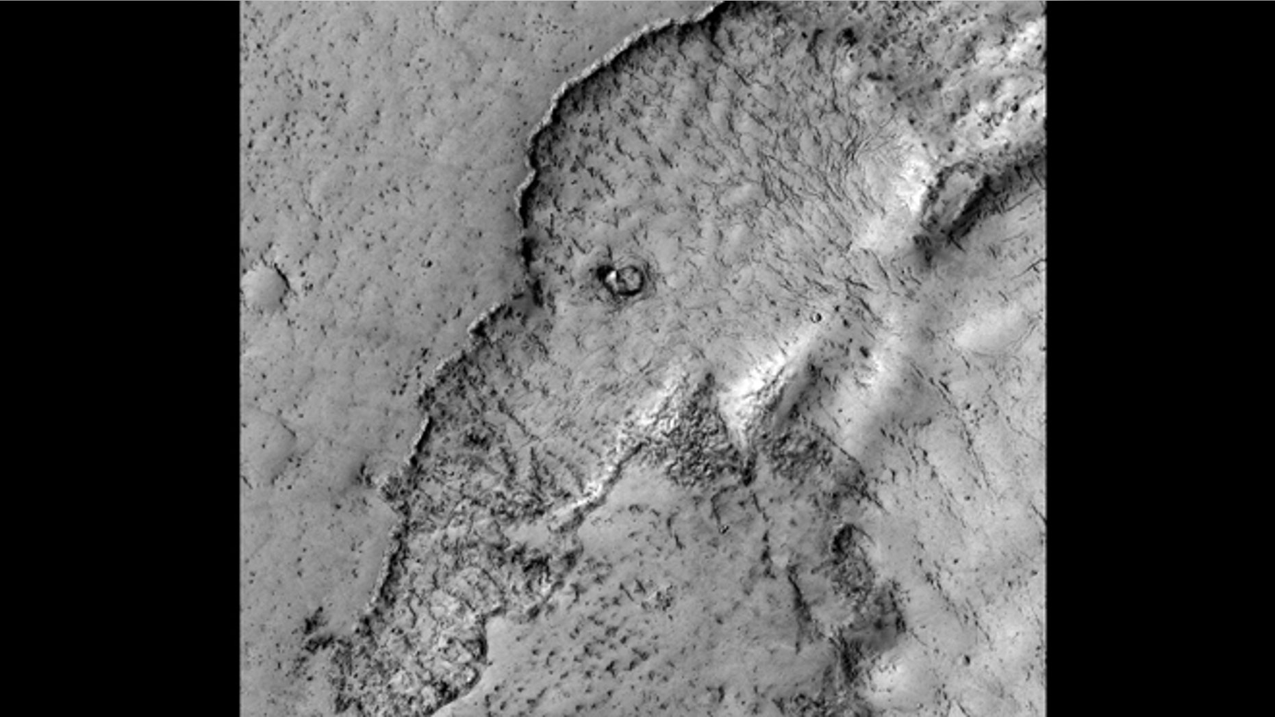 Apr. 4, 2012: This observation highlights Martian terrain that looks like an elephant. Actually, this image covers the margin of a lava flow in Elysium Planitia, the youngest flood-lava province on Mars. Flood lavas cover extensive areas, and were once thought to be emplaced extremely rapidly, like a flood of water.