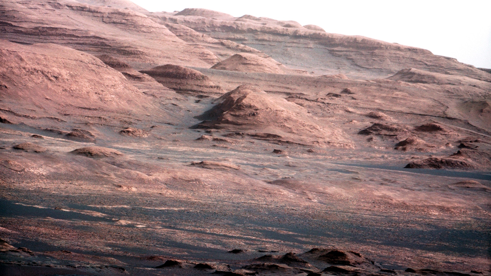 This image taken by NASA's Curiosity shows what lies ahead for the rover -- its main science target, informally called Mount Sharp.