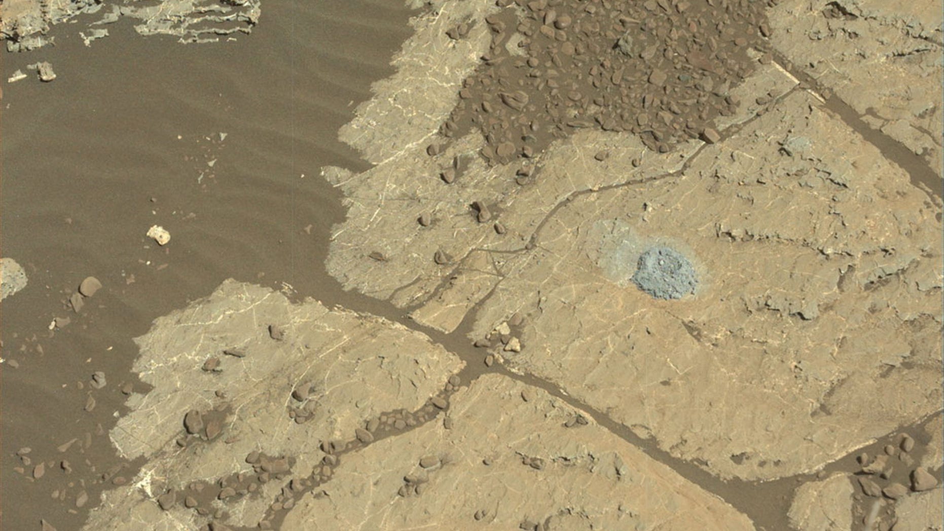 NASA's Mars rover Curiosity used a new drilling method to produce a hole on Feb. 26, 2018, in a rock target named Lake Orcadie. The hole marks the first operation of the rover's drill since a motor problem began acting up more than a year ago.