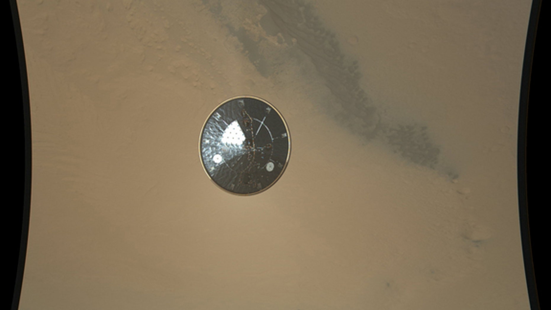 This color full-resolution image showing the heat shield of NASA's Curiosity rover was obtained during descent to the surface of Mars on Aug. 5 PDT (Aug. 6 EDT). The 15-foot heat shield was photographed by Curiosity's MARDI descent camera.