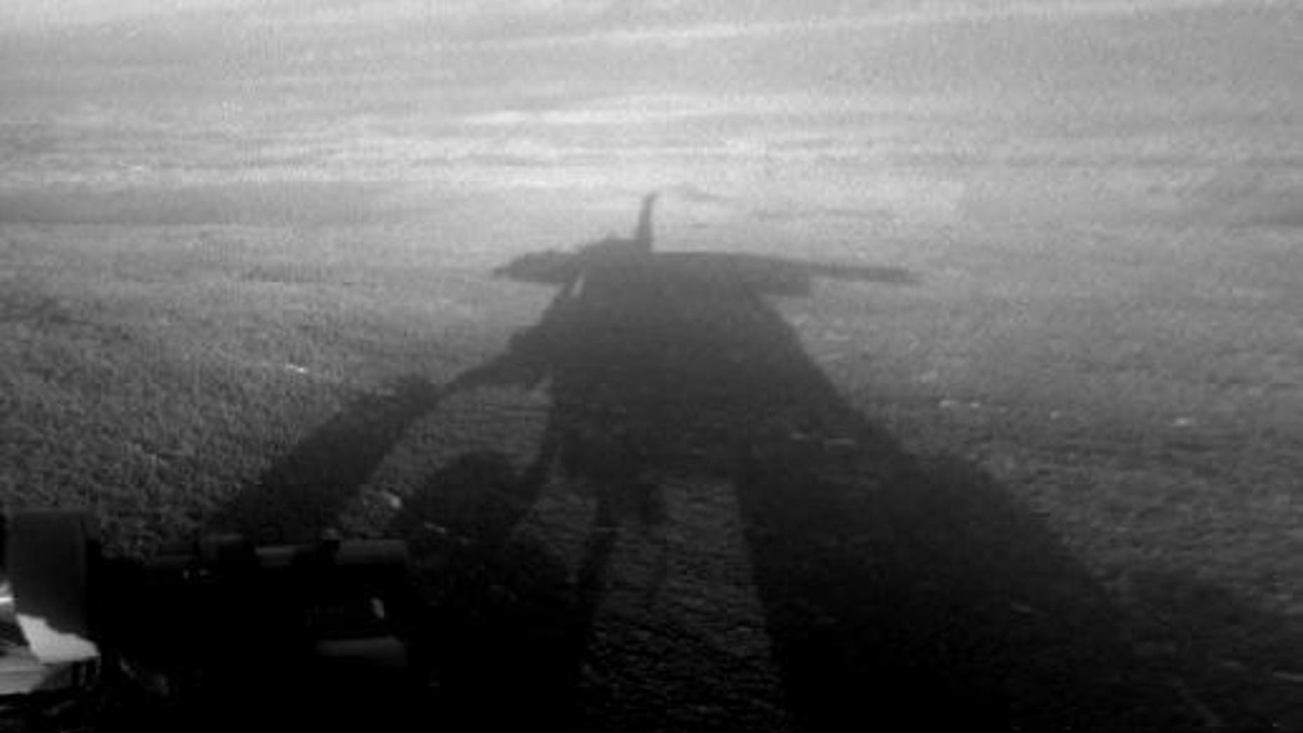 NASA's Mars Exploration Rover Opportunity captured this view of its afternoon shadow stretching into Endeavour Crater during the 3,051st Martian day, or sol, of Opportunity's work on Mars on Aug. 23, 2012.