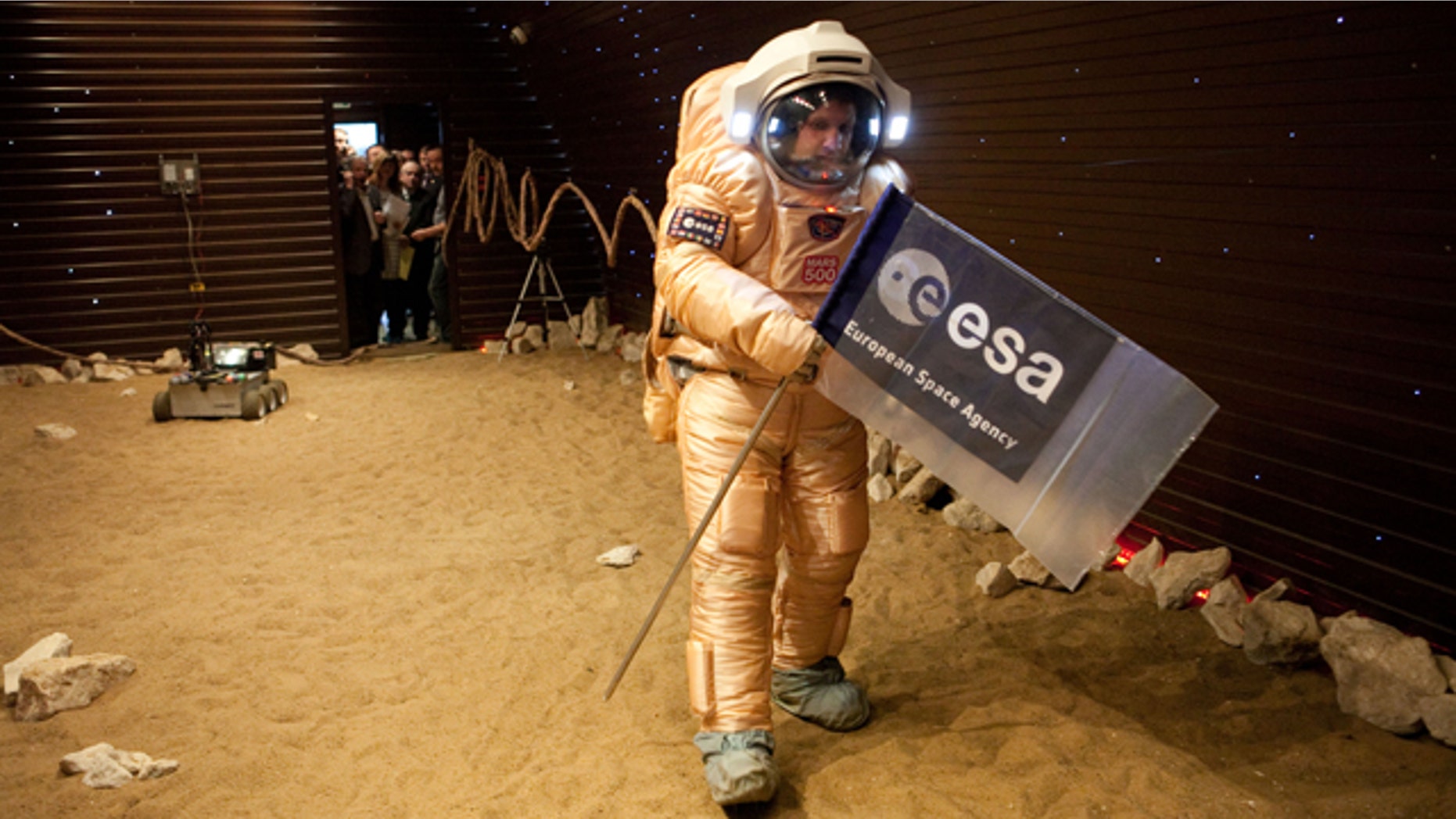 Crew training for 'Marswalk' at the simulated martian terrain of the Mars500 experiment. The terrain, about 10 m long and 6 m wide, is covered with reddish sand and is built to resemble the surface at Gusev crater.
