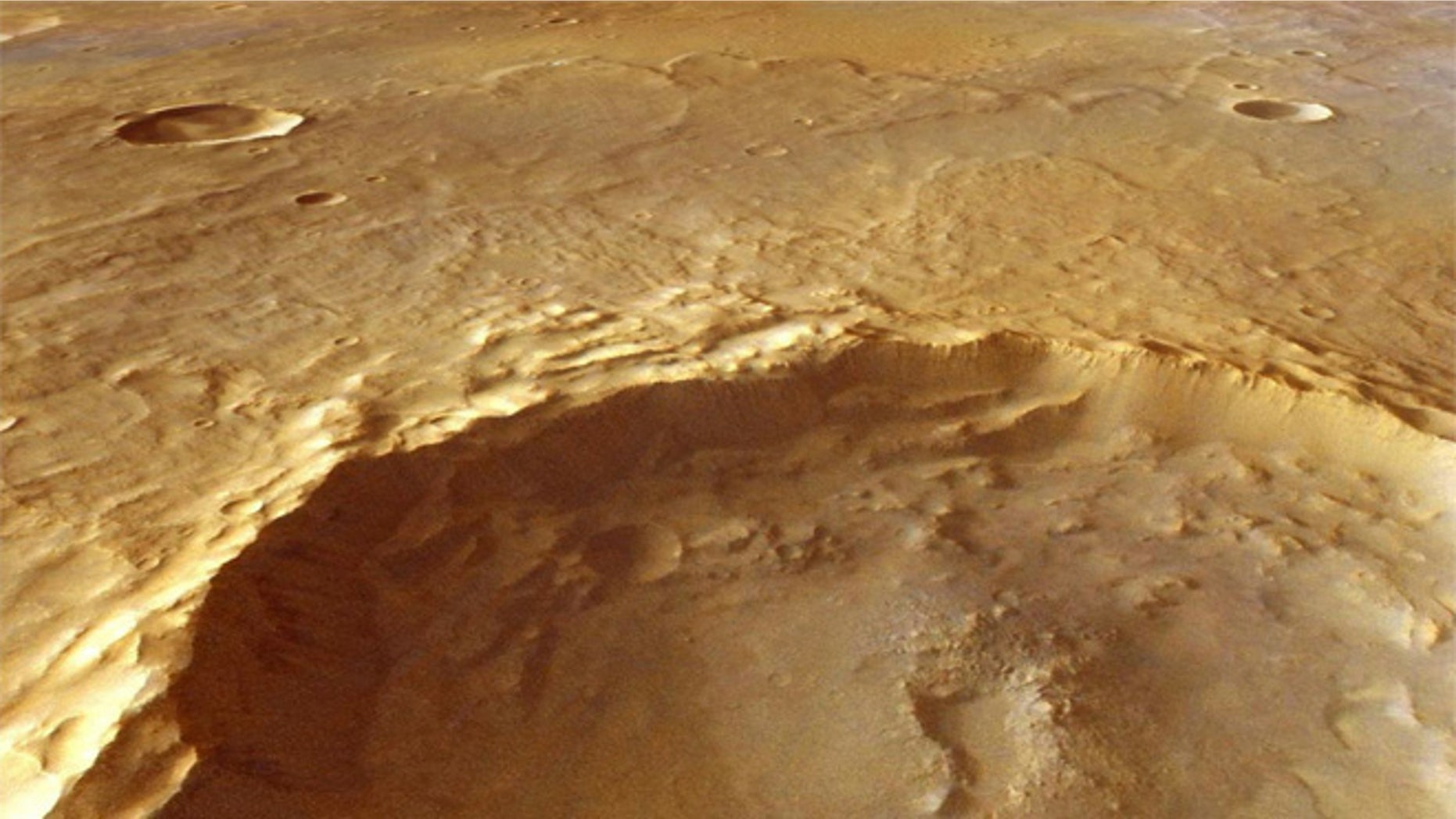 This large crater, which measures15 miles (25 kilometers) across, has excavated rocks which have been altered by groundwater in the crust before the impact occurred. Using ESA's Mars Express and NASA's Mars Reconnaissance Orbiter, scientists have identified hydrated minerals in the central mound of the crater, on the crater walls and on the large ejecta blanket around the crater.