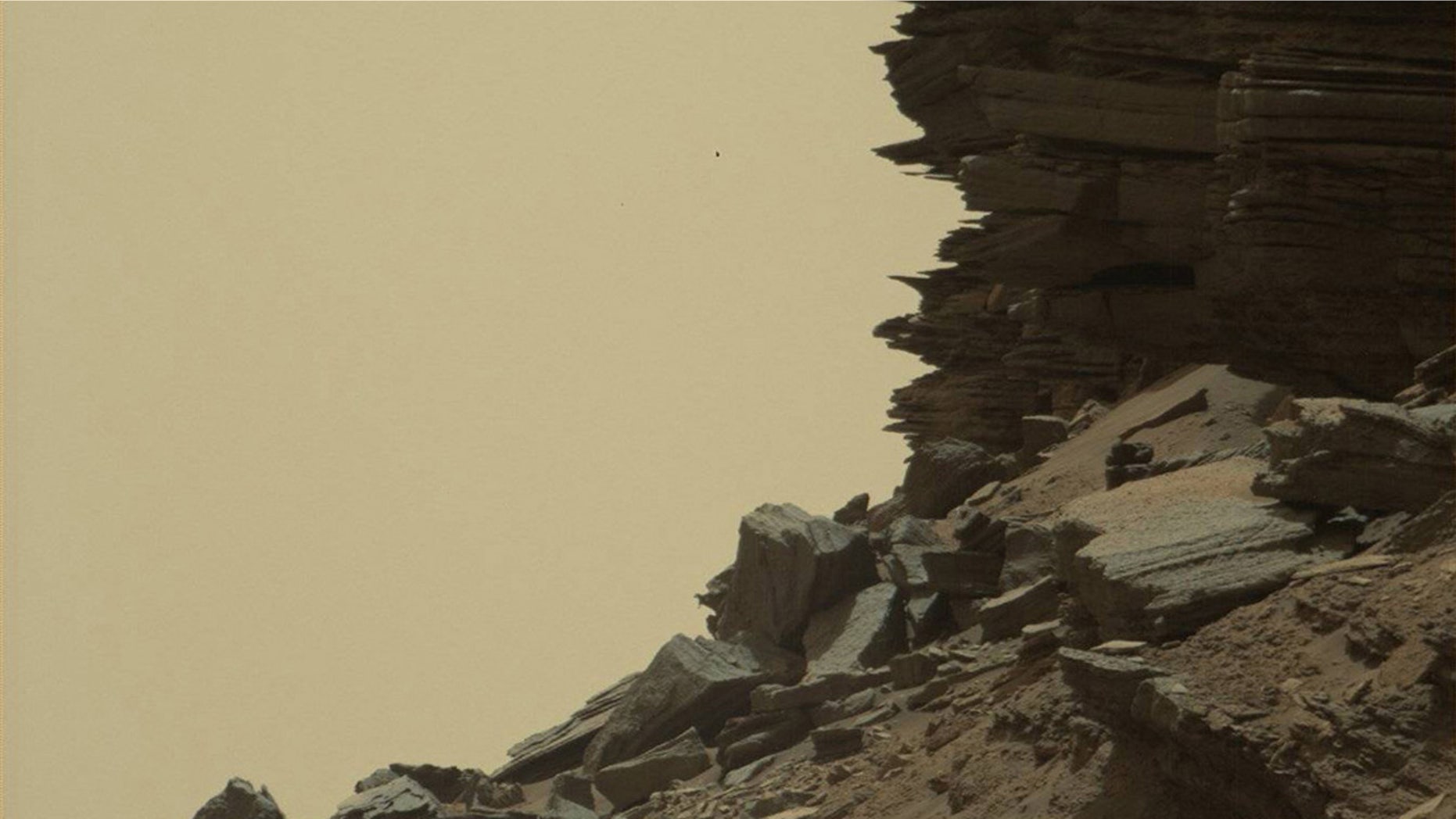 Sept. 8, 2016: This image take by the Mars Curiosity Rover shows a dramatic hillside outcrop with sandstone layers.