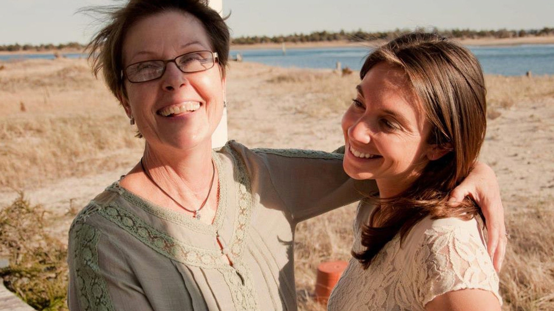 Mary Latham, 29 (right), with her mother, Pat (left), who lost her battle with breast cancer at age 61 in 2013. Latham is on a cross-country road trip gathering positive stories from strangers in honor of her mom, who always encouraged her daughter to look for the good in people and situations.