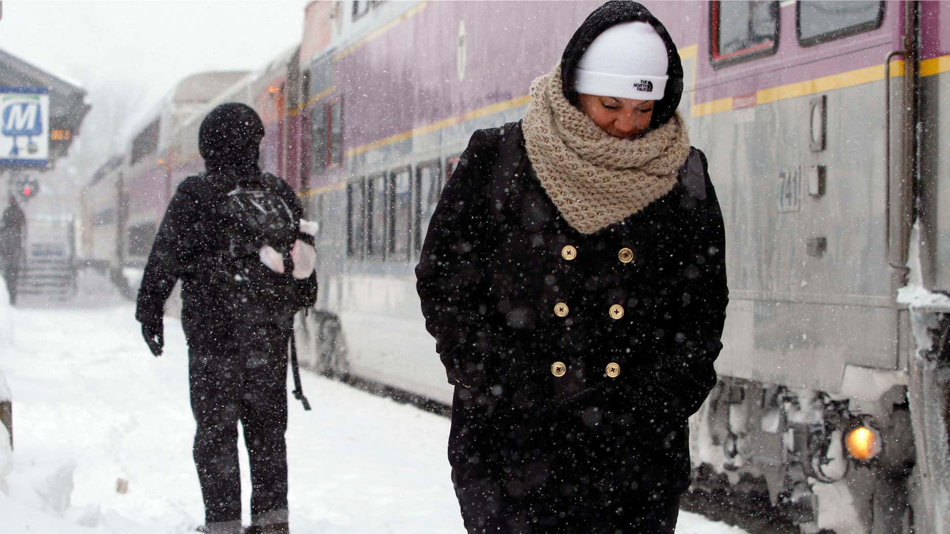Feb. 9, 2015: Passengers wait at the commuter rail train station.