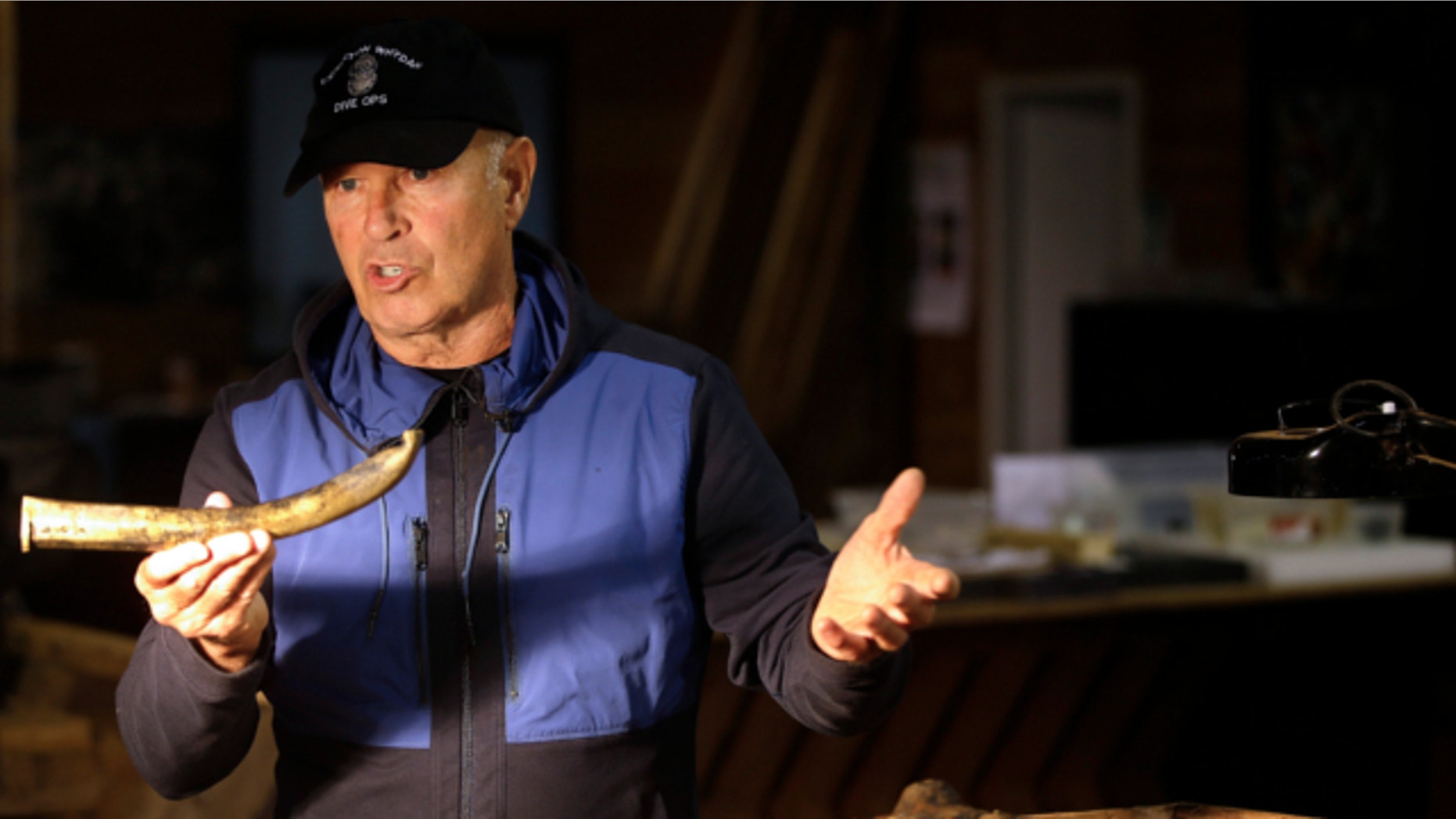 Sept. 17, 2013: Underseas explorer Barry Clifford holds the barrel of a partially crushed blunderbuss he salvaged from the wreck of pirate ship "Whydah" during a video interview in Brewster, Mass.
