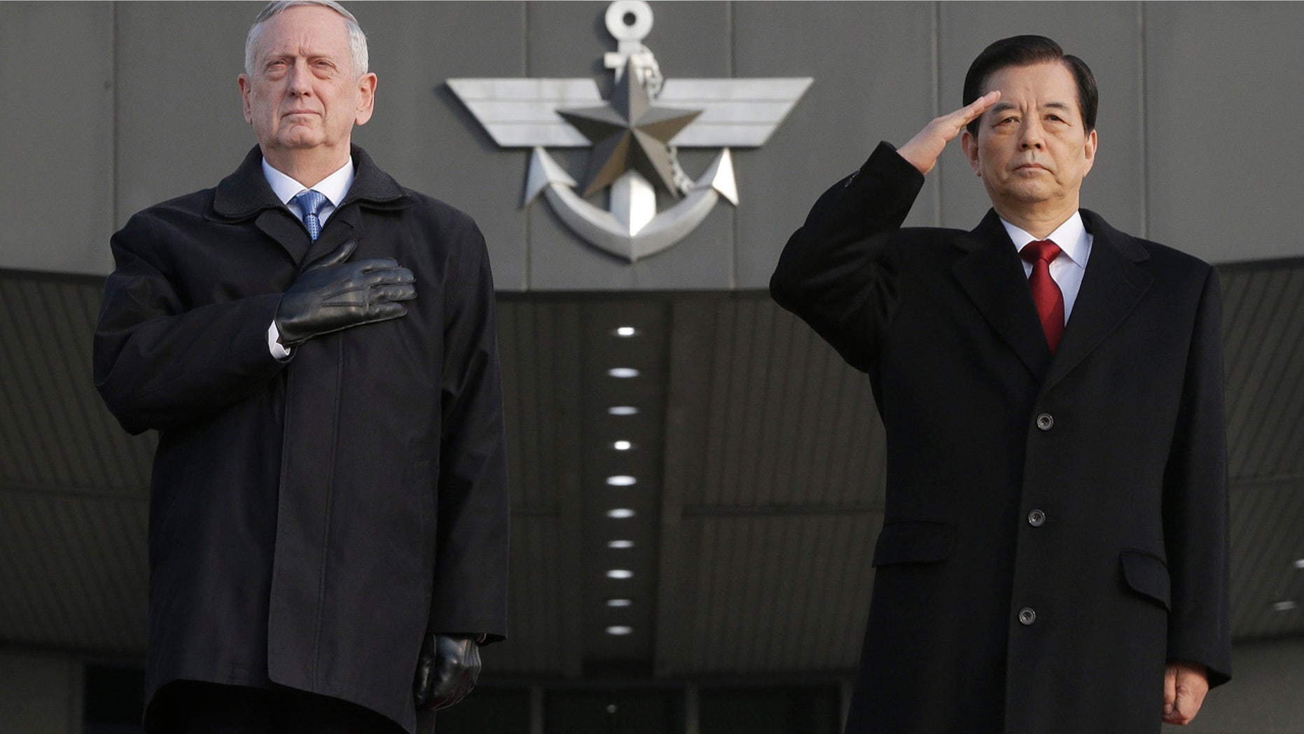 Feb. 3, 2017: U.S. Defense Secretary Jim Mattis, left, and South Korean Defense Minister Han Min Koo salute during a welcome ceremony for Mattis at the Defense Ministry in Seoul.