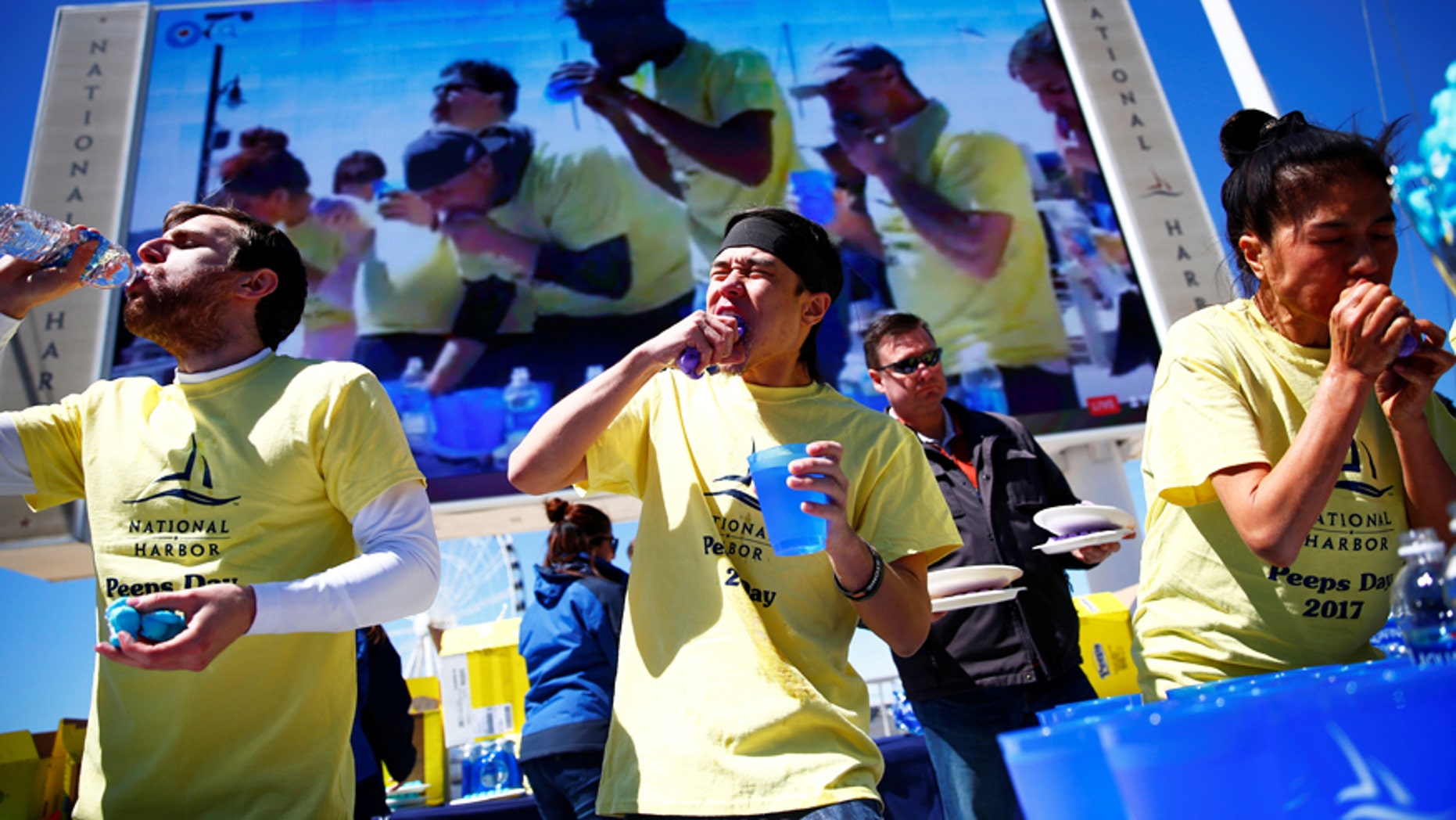 Matt Stonie is flanked by other competitors at the National Harbor World Peeps Eating Championship in National Harbor, Md.