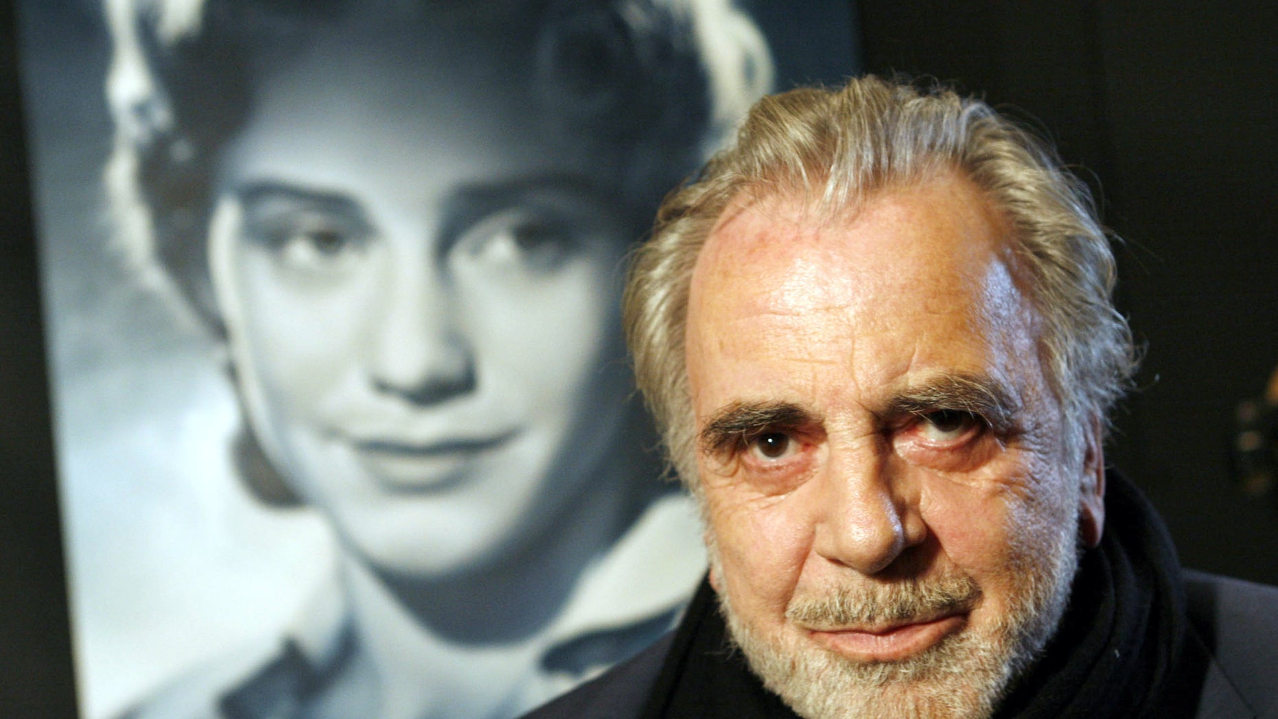 Jan. 30, 2007 file picture actor Maximilian Schell poses in front of a poster of his sister Maria Schell in Frankfurt, Germany.