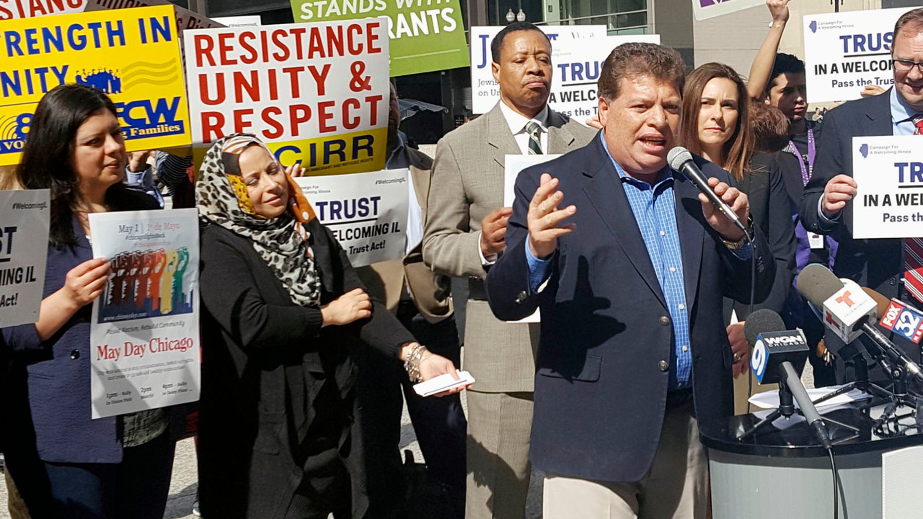 In this April 24, 2017, photo Artemio Arreola, an organizer with the Illinois Coalition for Immigrant and Refugee Rights, speaks to other advocates in downtown Chicago.