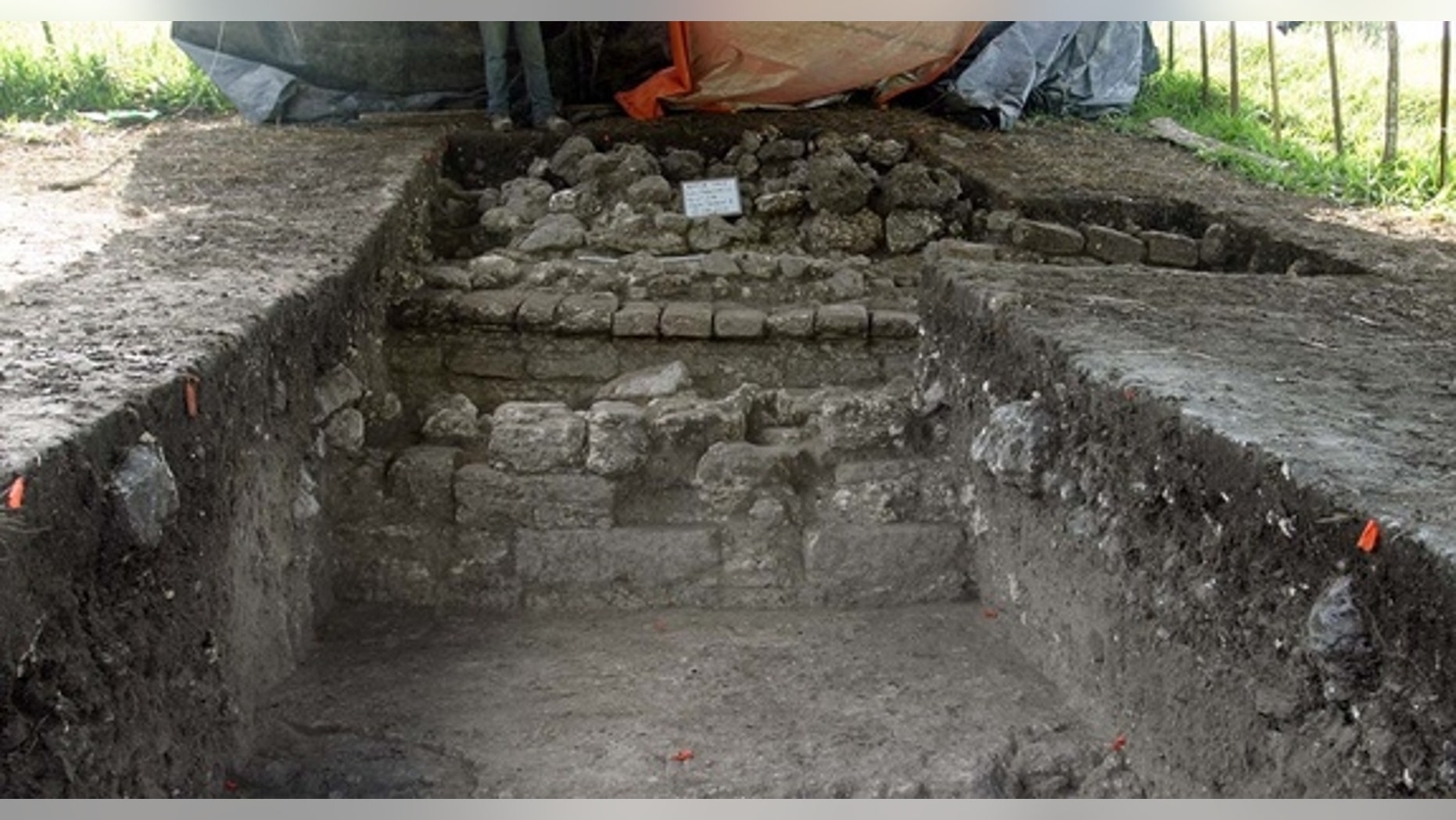 In the course of excavating remains of the Mayan city, archaeologists uncovered a corridor containing shiny white plaster that originally would have covered the city.