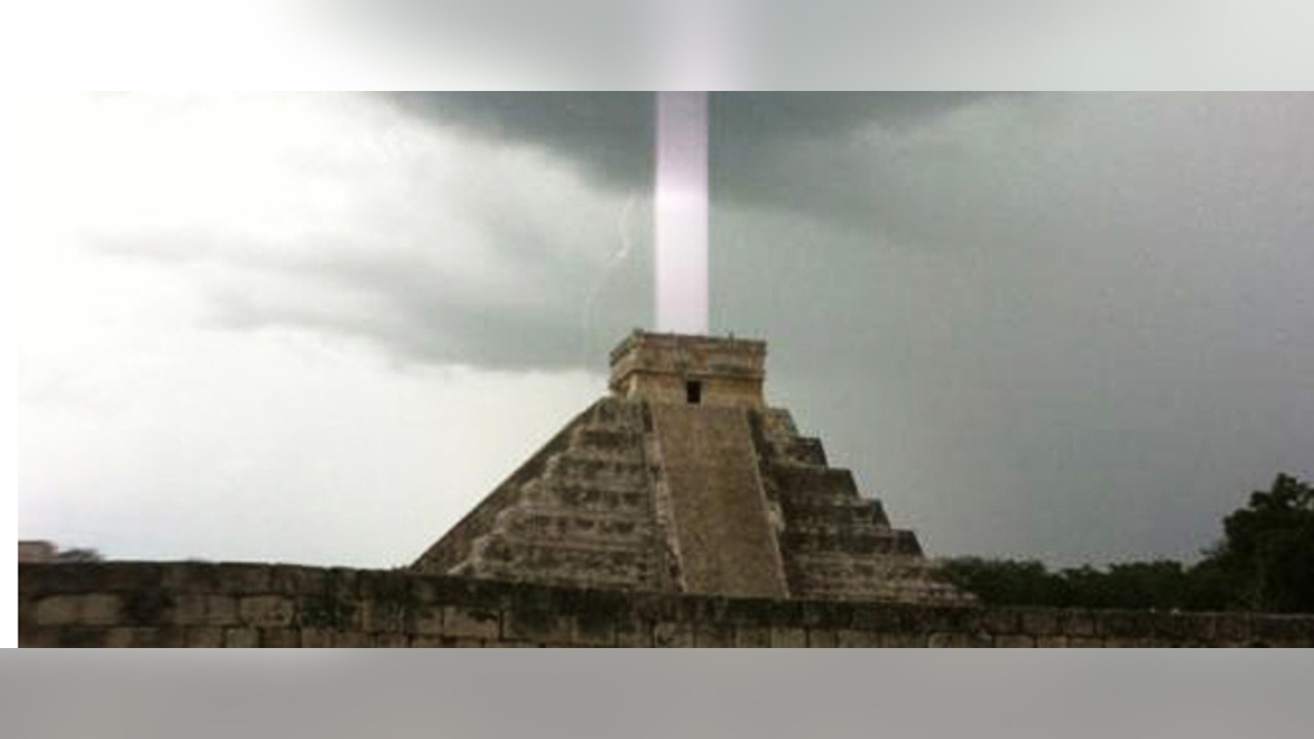 "El Castillo," a Mayan temple on the Yucatan Peninsula in Mexico, with a mysterious "light beam" emerging from the top.