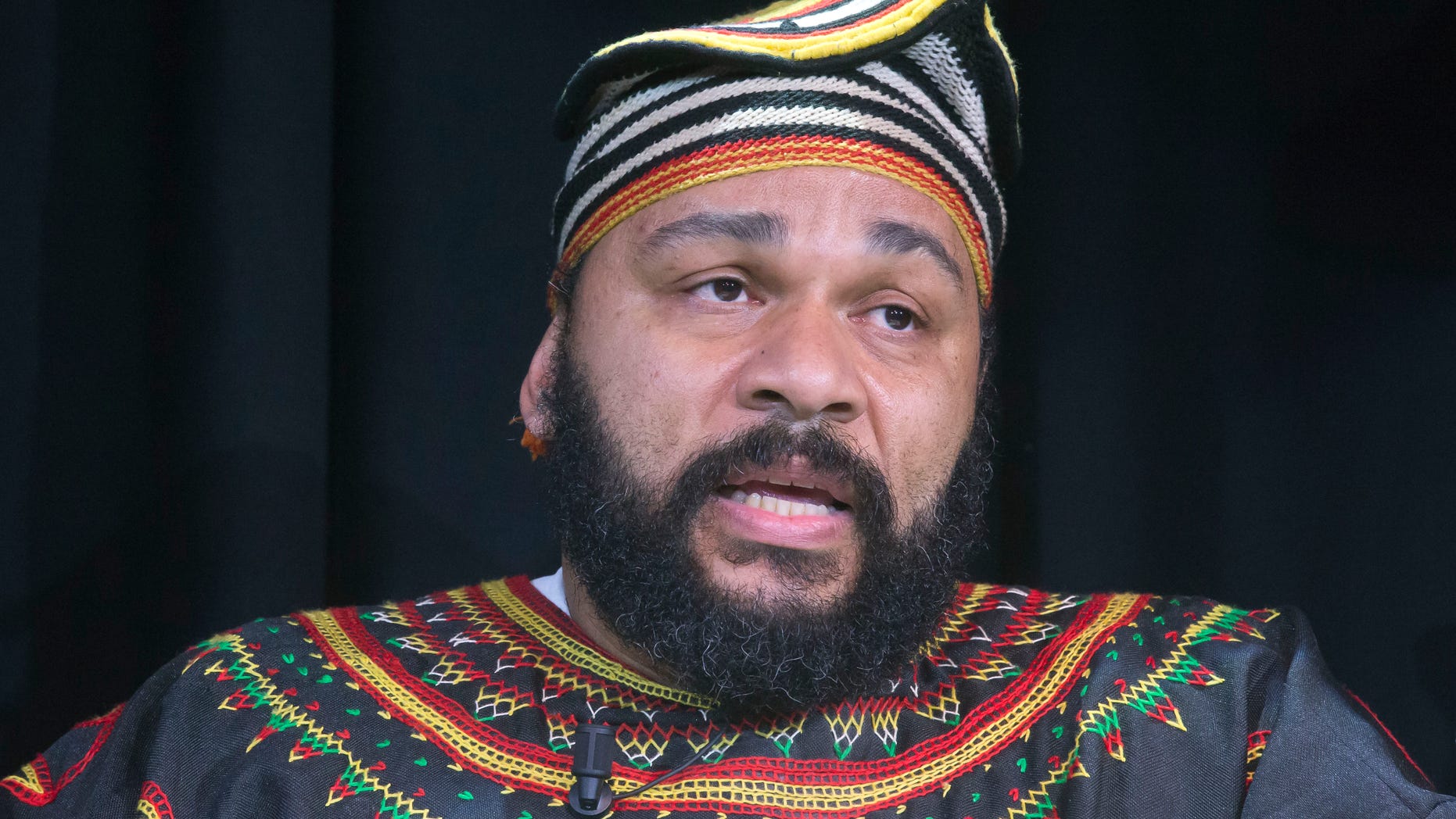 Jan. 11, 2014. French comic Dieudonne M'Bala M'Bala speaks to the media during a press conference in a theater in Paris. The French comic whose gesture touched off allegations of anti-Semitism and prompted a government ban on his shows is defiant, saying the quenelle has nothing to do with the Nazi salute.