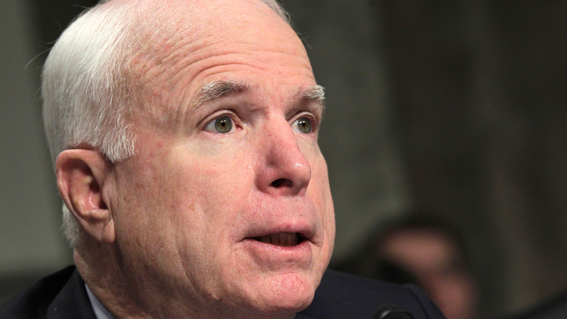 Sen. John McCain, R-Ariz., the ranking Republican on the Senate Armed Services Committee, addresses Gen. David Petraeus, commander of U.S. and NATO forces in Afghanistan, as he testifies before the committee, on Capitol Hill in Washington, Tuesday, March 15, 2011. (AP)