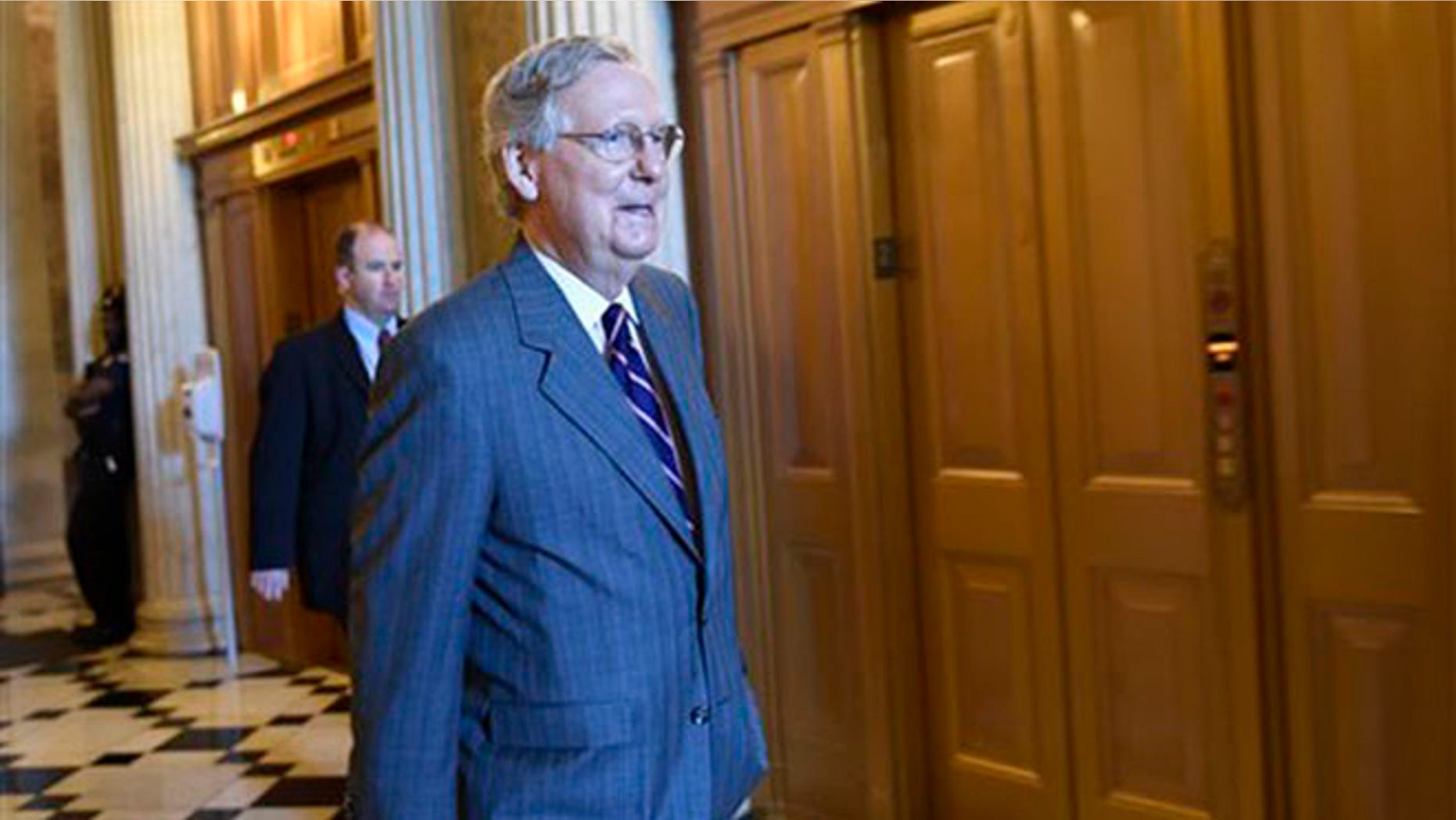 Senate Majority Leader Mitch McConnell of Ky. walks to a Republican luncheon on Capitol Hill in Washington, Friday, May 22, 2015.