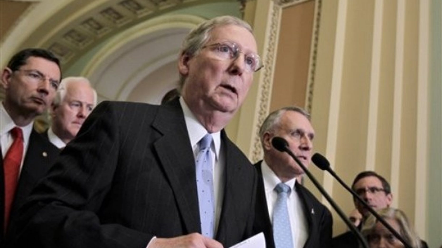 FILE: In this May 10, 2011, photo, Senate Minority Leader Mitch McConnell, R-Ky., speaks with reporters on Capitol Hill. On the far right is Minority Whip Jon Kyl of Arizona.