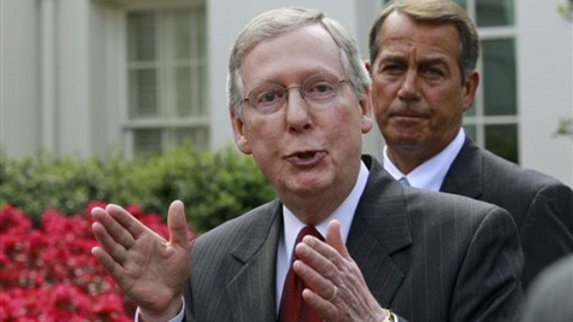 Senate Minority Leader Mitch McConnell, accompanied by House Minority Leader John Boehner, talks to reporters outside the White House April 14. (AP Photo)