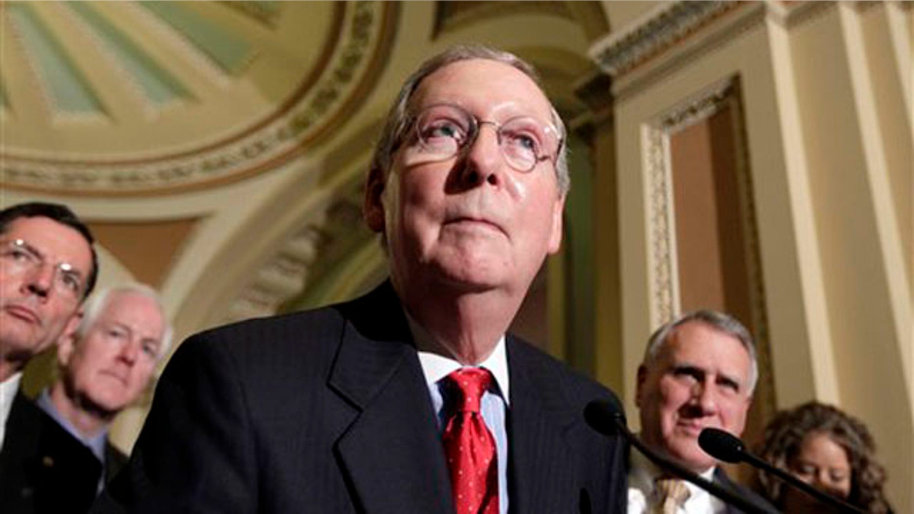 Senate Minority Leader Mitch McConnell speaks with reporters following a weekly Republican policy luncheon June 28 on Capitol Hill.