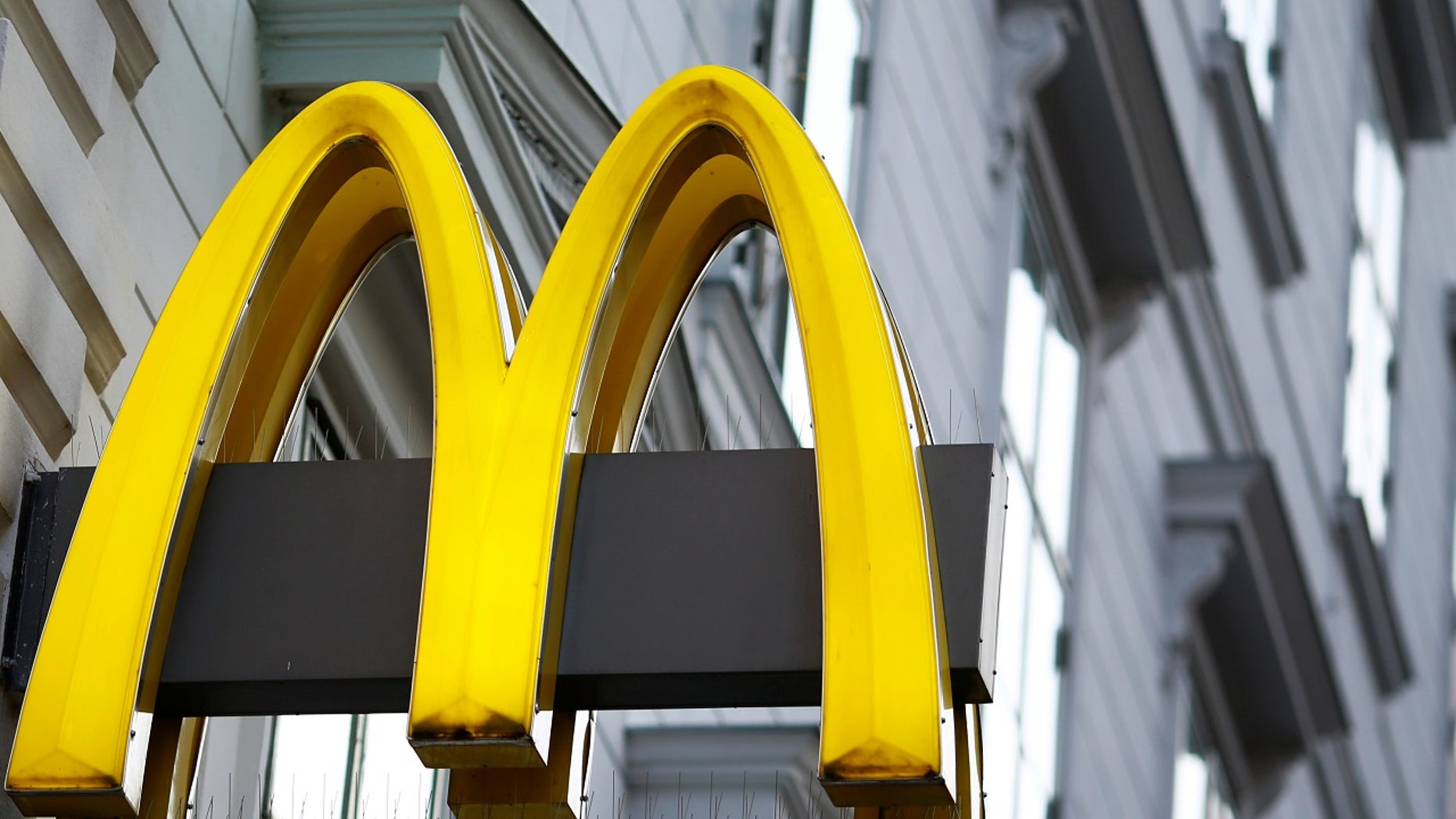 The logo of McDonalds is seen outside a shop in Vienna in Vienna, Austria, October 1, 2016. REUTERS/Leonhard Foeger - - RTSR03F