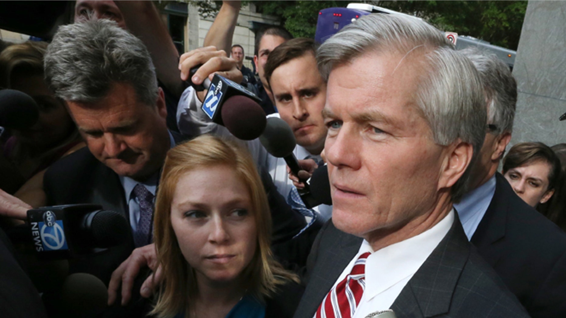 Aug. 21, 2014: Former Virginia governor Bob McDonnell puts his arm around his daughter Cailin Young as he leaves the federal courthouse in Richmond, Va.