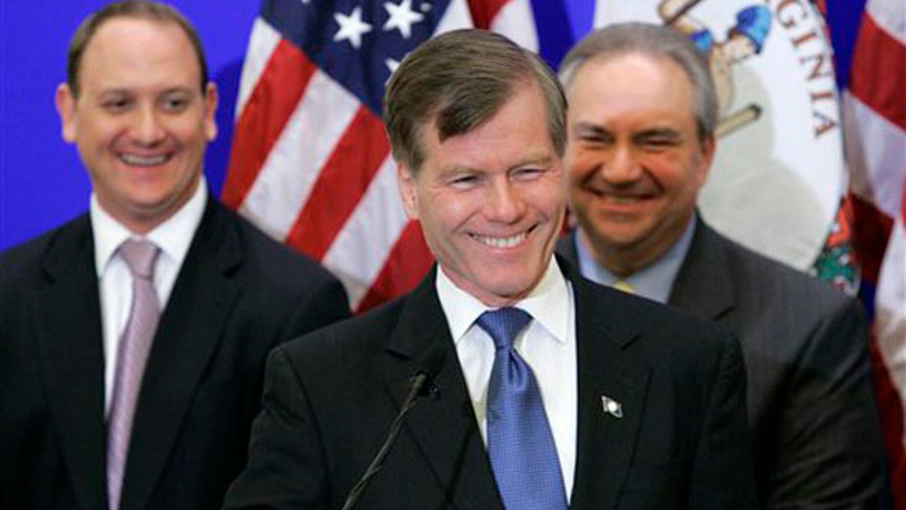 Republican Gov-elect Bob McDonnell smiles at a news conference with transition members, Phil Cox, left, and Lt. Gov. Bill Bolling, right, in Richmond Nov. 4. (AP Photo)