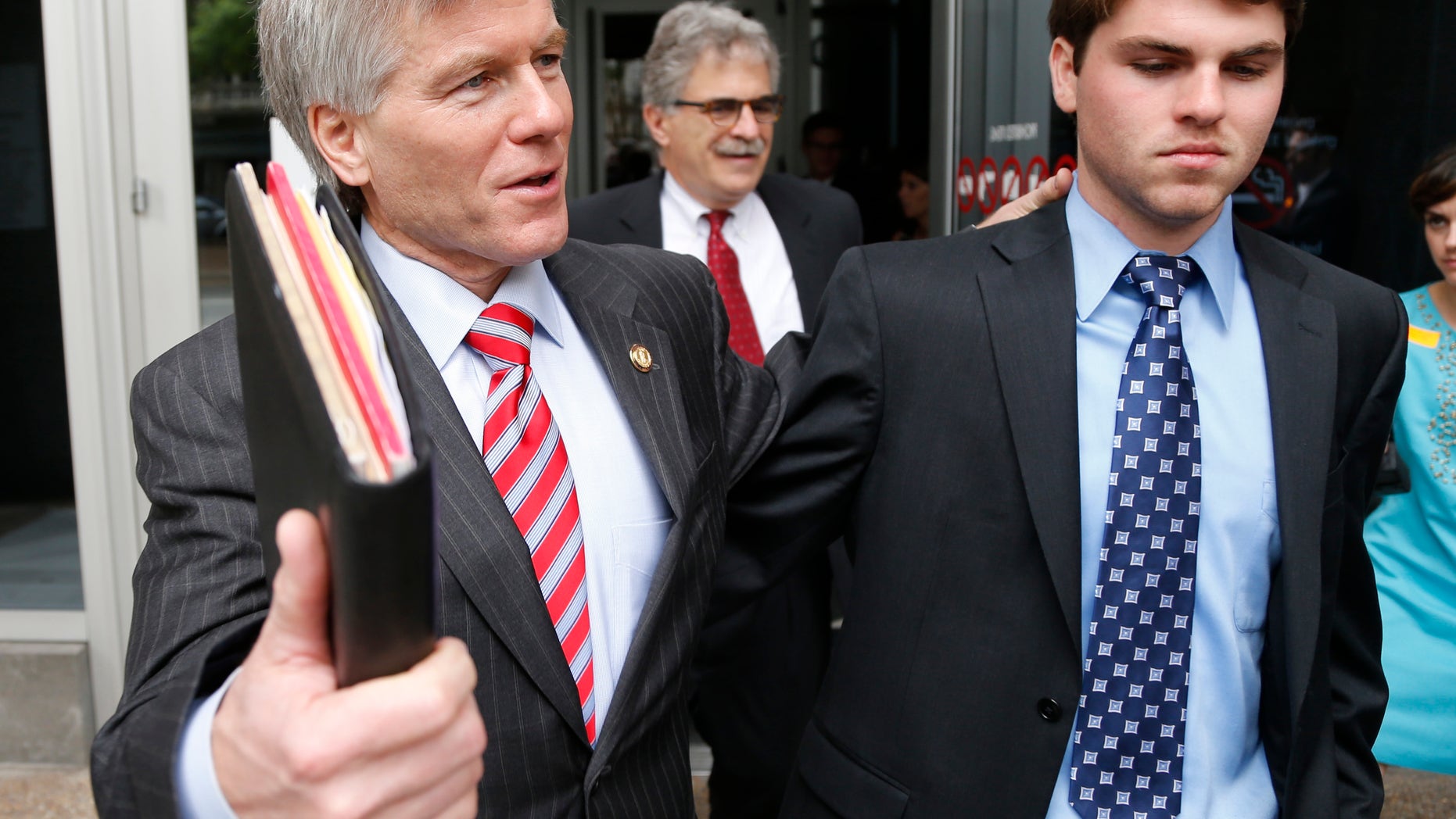 Sept. 3, 2014: Former Virginia Gov. Bob McDonnell, left, leaves Federal Court with his son Bobby as the jury begins its second day of deliberations in his corruption trial in Richmond, Va.