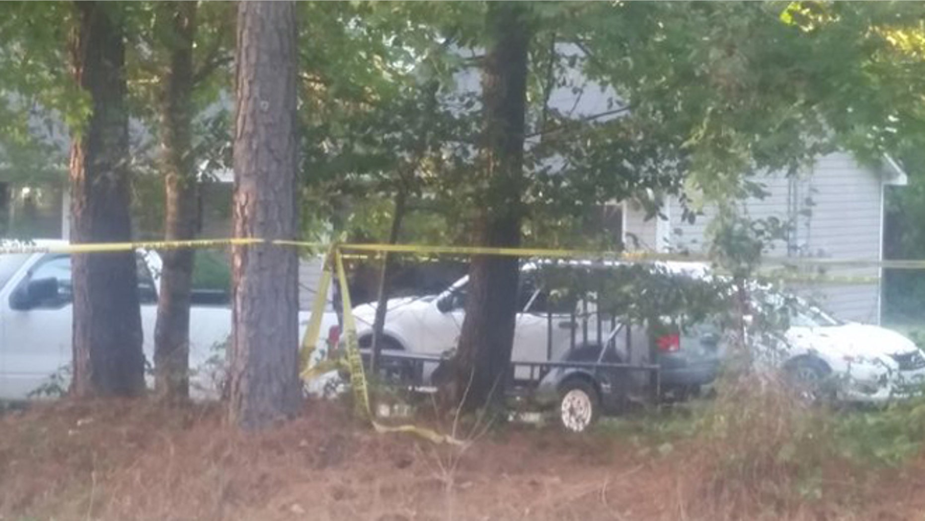 Police tape surrounds home where a young boy was shot and killed Saturday in McDonough, Georgia. (Fox 5 Atlanta)