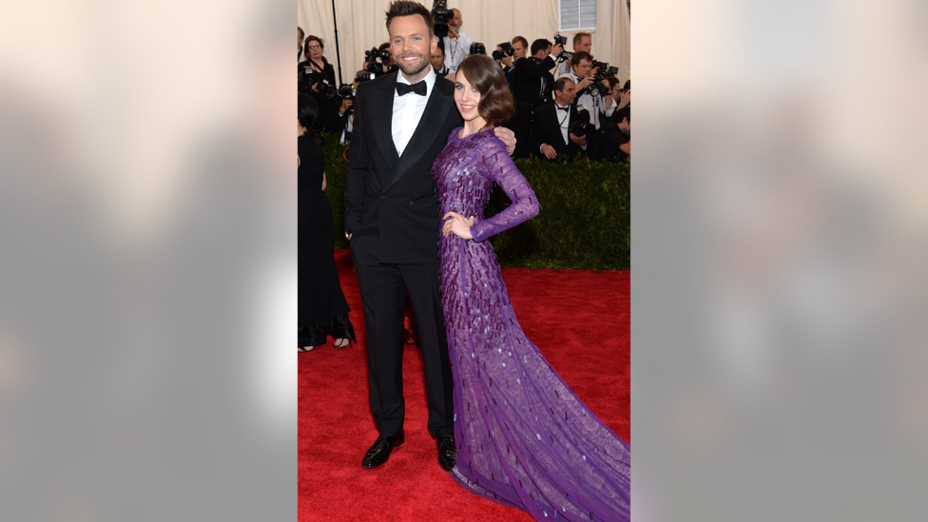 Joel McHale, left, and Alison Brie arrive at The Metropolitan Museum of Art's Costume Institute benefit gala celebrating "China: Through the Looking Glass" on Monday, May 4, 2015, in New York.