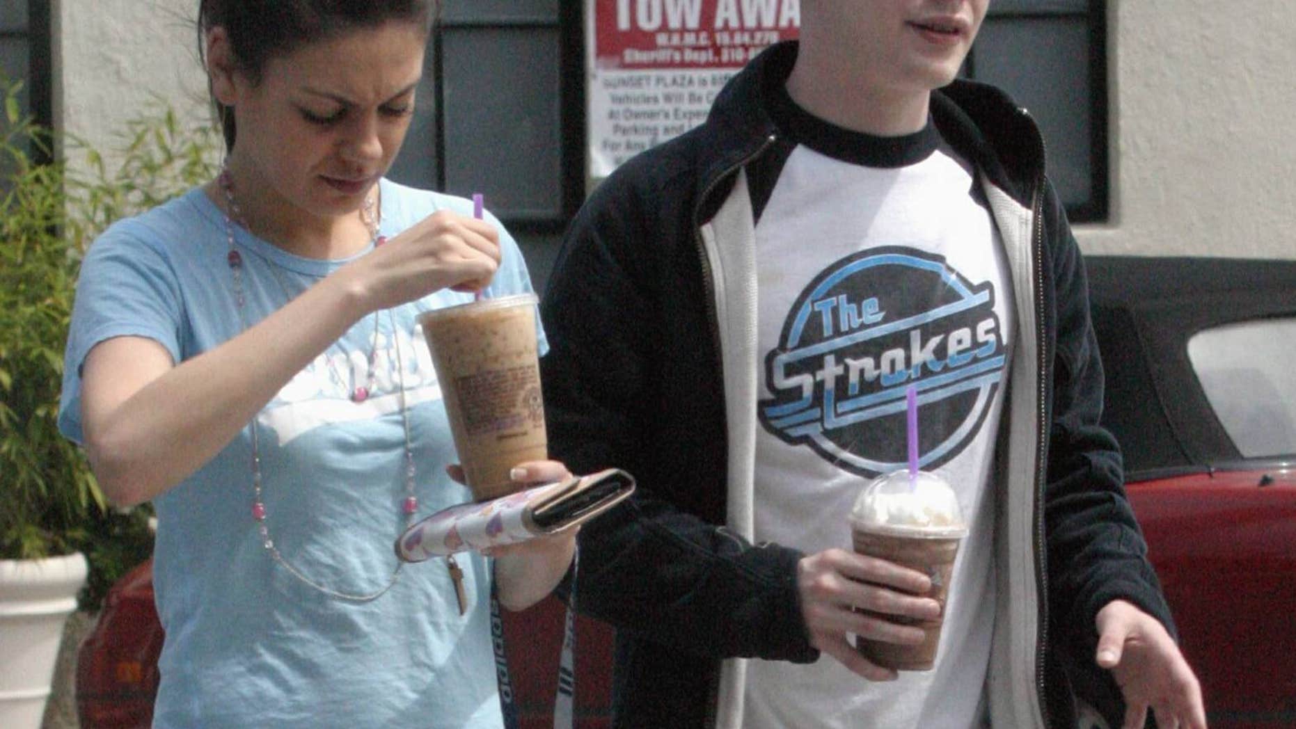 Mila Kunis (left) with then-boyfriend Macaulay Culkin after he testified at the Michael Jackson trial in 2005.