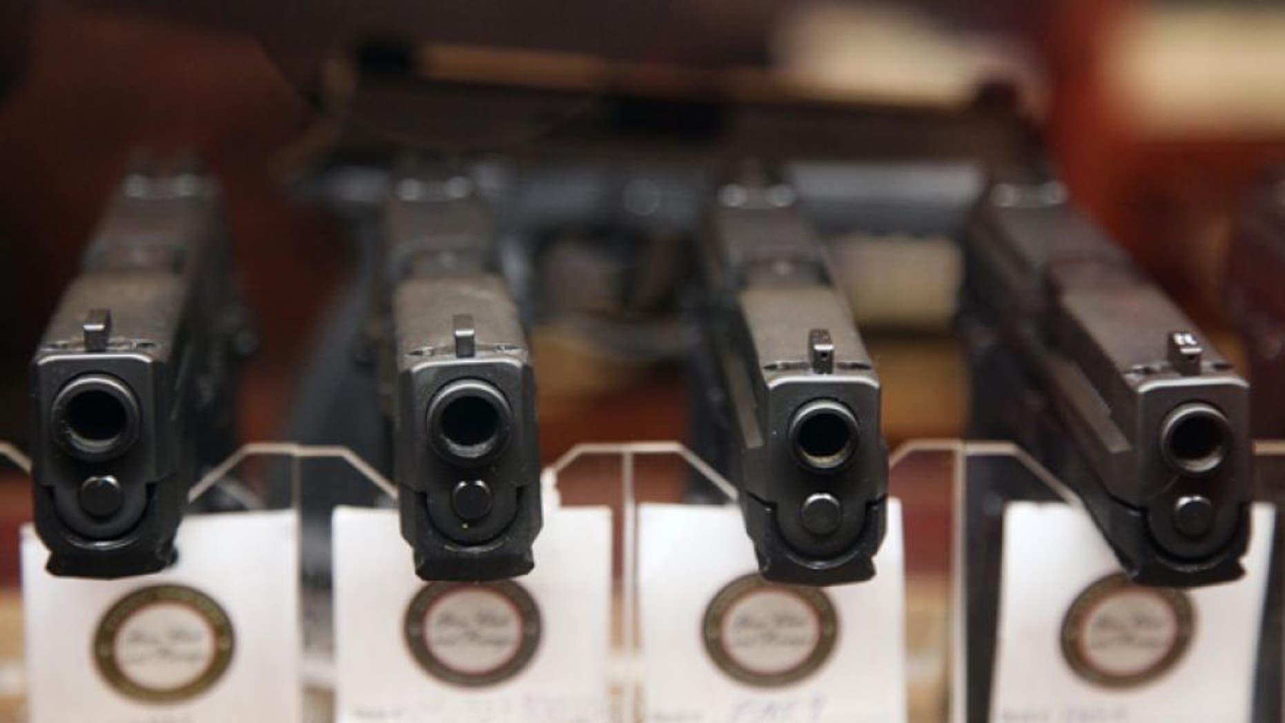 Jan. 4, 2013: Handguns are displayed in the sales area of Sandy Springs Gun Club and Range, in Sandy Springs, Ga.