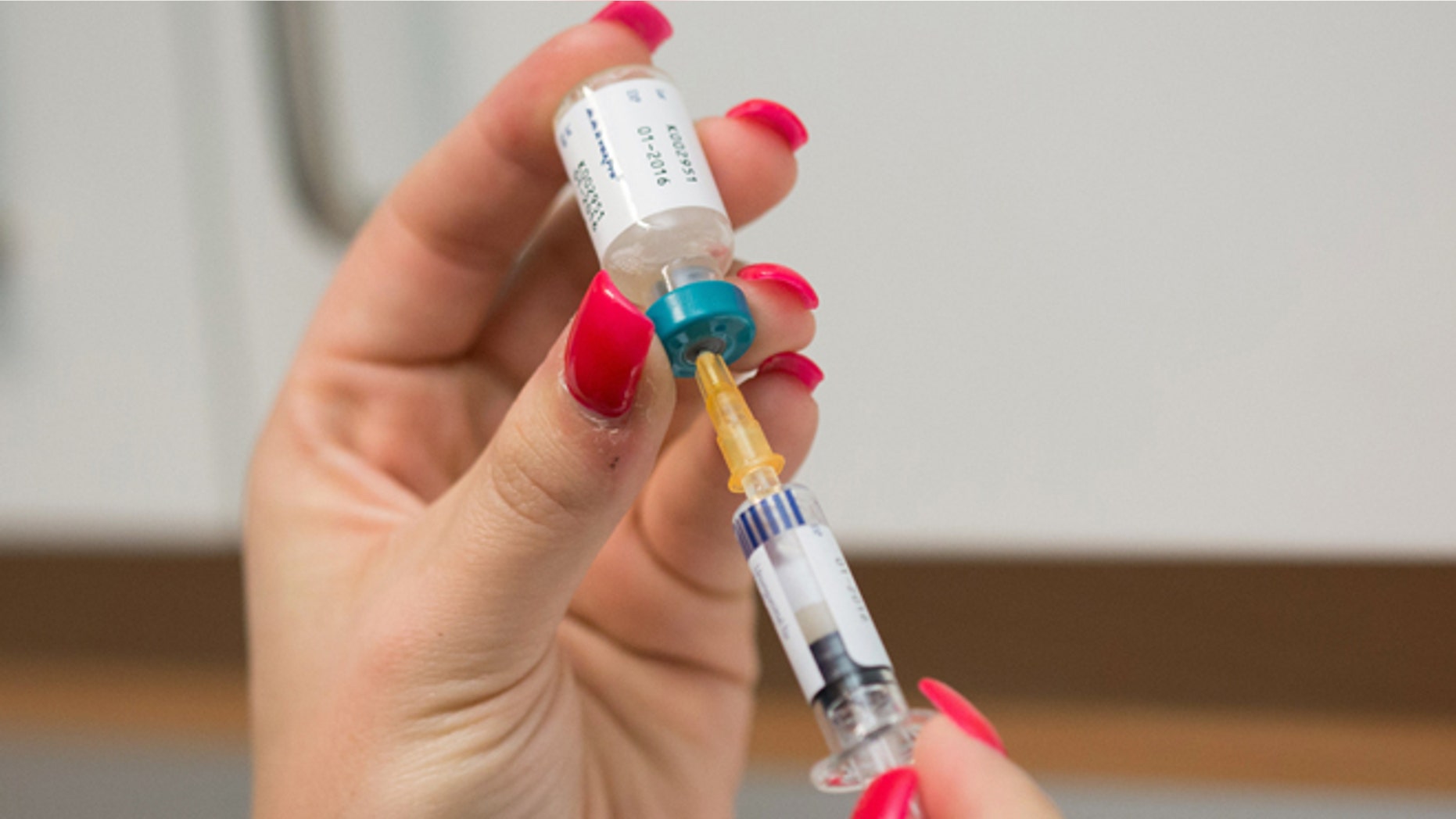Feb. 24, 2015: A doctor's assistant prepares a measles vaccination in Berlin, Germany.