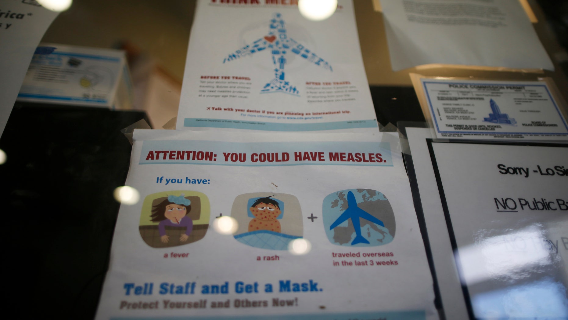 A measles poster is seen at Venice Family Clinic in Los Angeles, California February 5, 2015. REUTERS/Lucy Nicholson