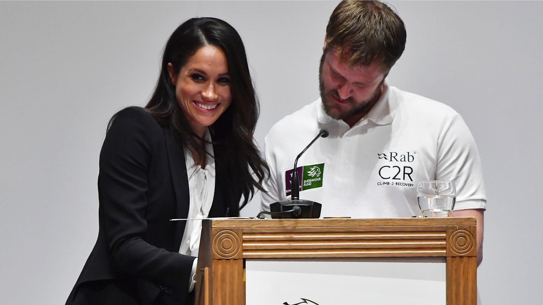 Meghan Markle gives a smile during an awkward moment while helping to present awards at the annual Endeavour Found Awards gala in London.