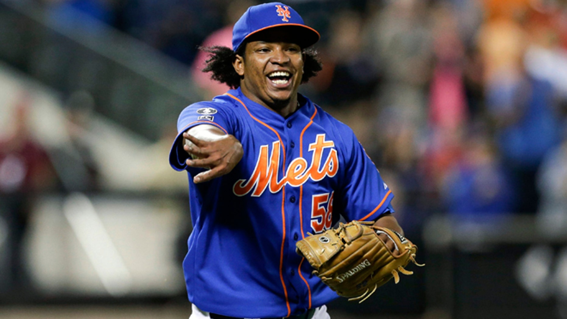 Sept. 10, 2014: New York Mets relief pitcher Jenrry Mejia tosses the ball to throw out Colorado Rockies' Josh Rutledge at first base to end a baseball game in New York. (AP)