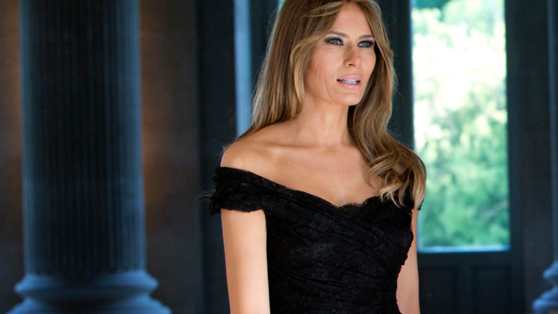 Melania Trump wears a black Dolce & Gabbana dress prior to a group photo during the spouse and partner program at the Royal Palace of Laeken, near Brussels on May 25, 2017.