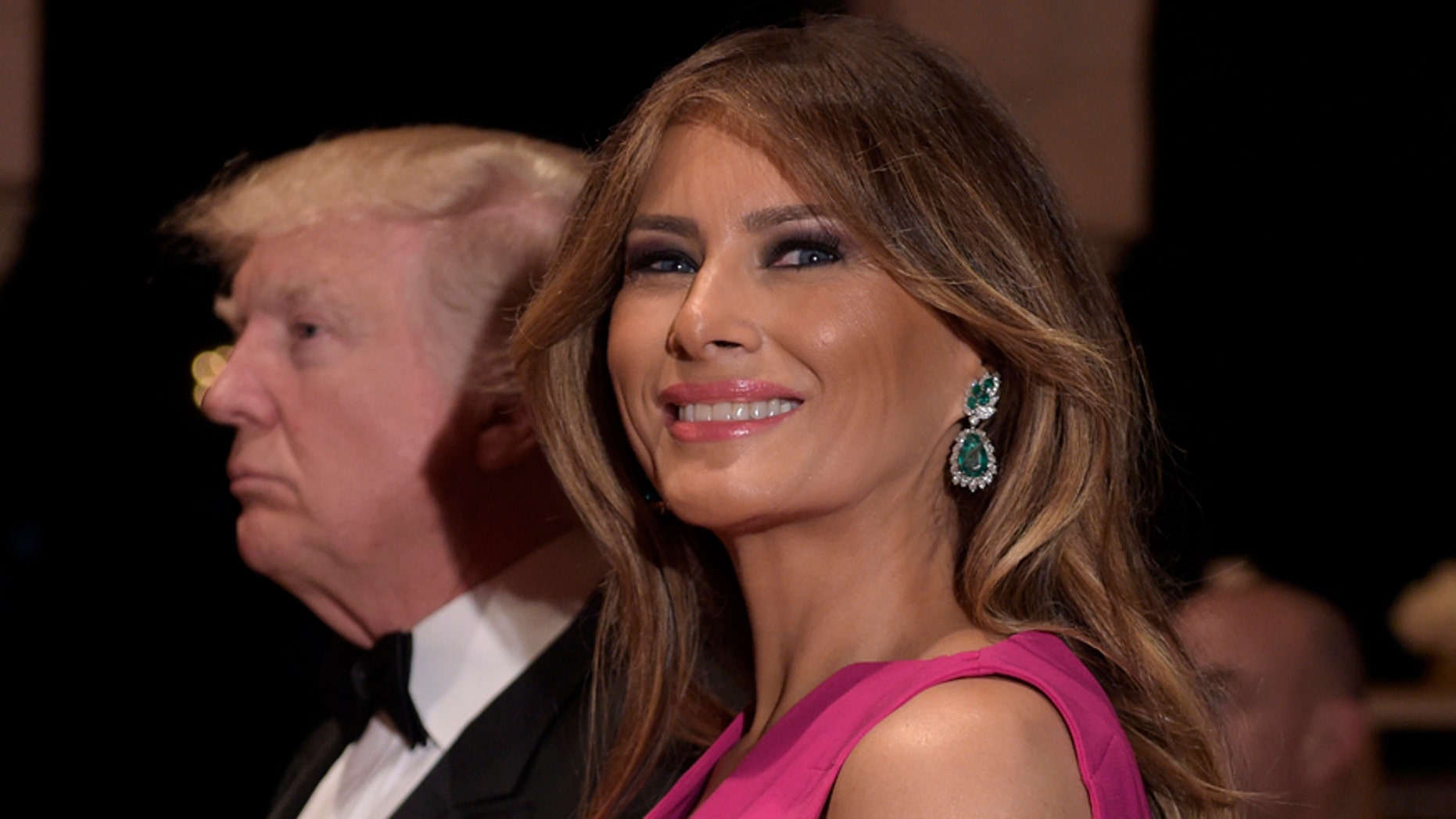 President Donald Trump and first lady Melania Trump arrive for the 60th annual Red Cross Gala at Trump's Mar-a-Lago resort in Palm Beach, Fla., Saturday, Feb. 4, 2017. (AP Photo/Susan Walsh)
